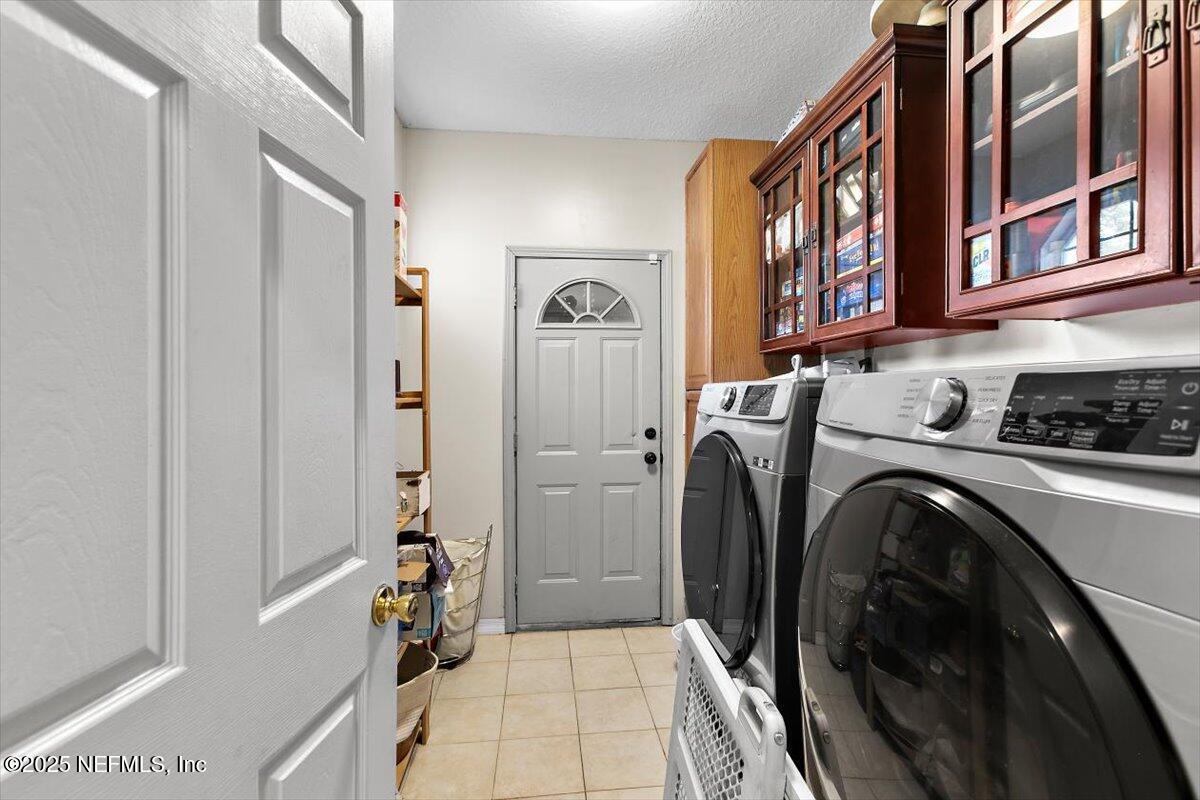 55214 Yellow Jacket Drive Callahan, FL 32011 - Photo 22 of 32 a utility room with dryer and washer