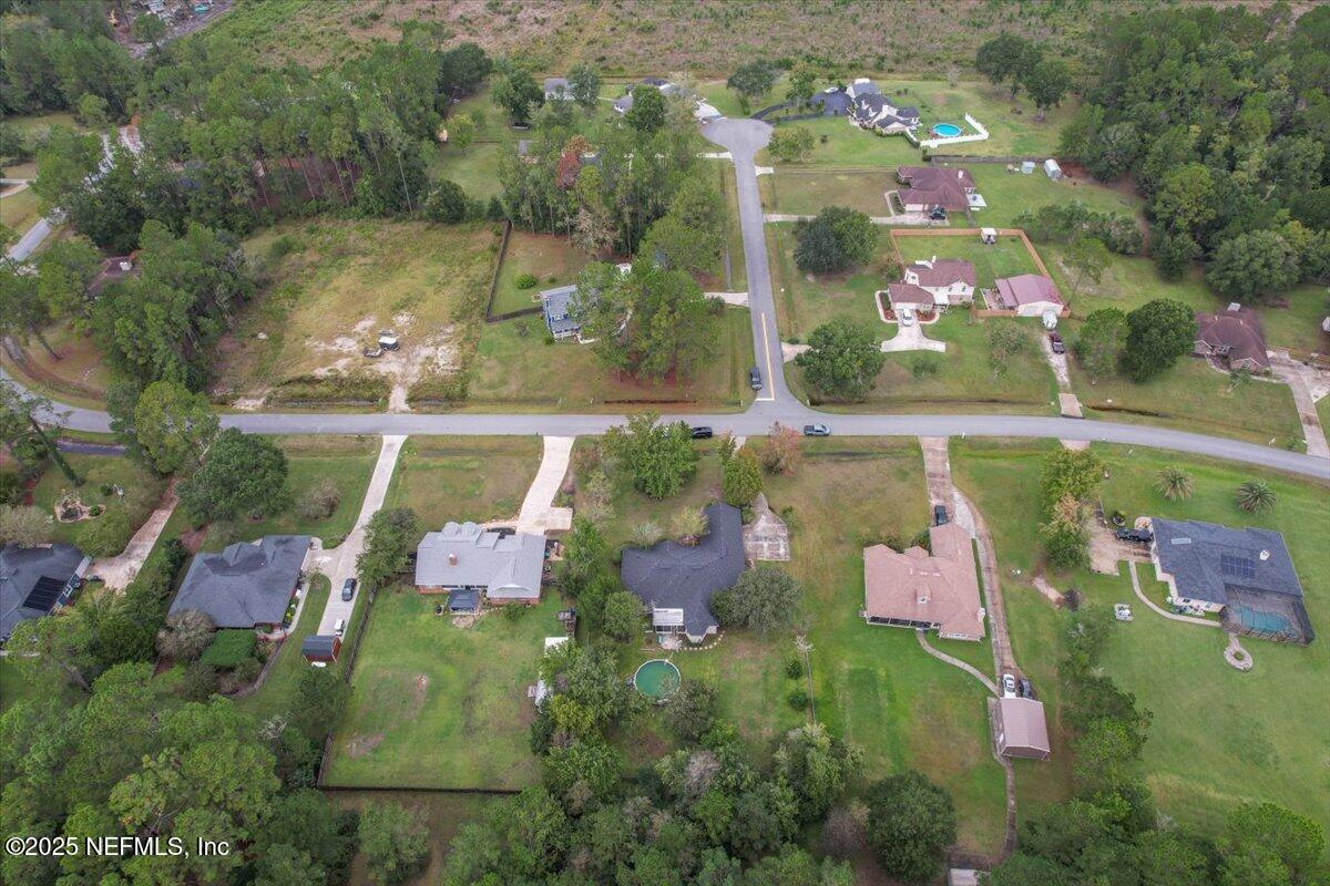 55214 Yellow Jacket Drive Callahan, FL 32011 - Photo 30 of 32 an aerial view of residential house with outdoor space and swimming pool