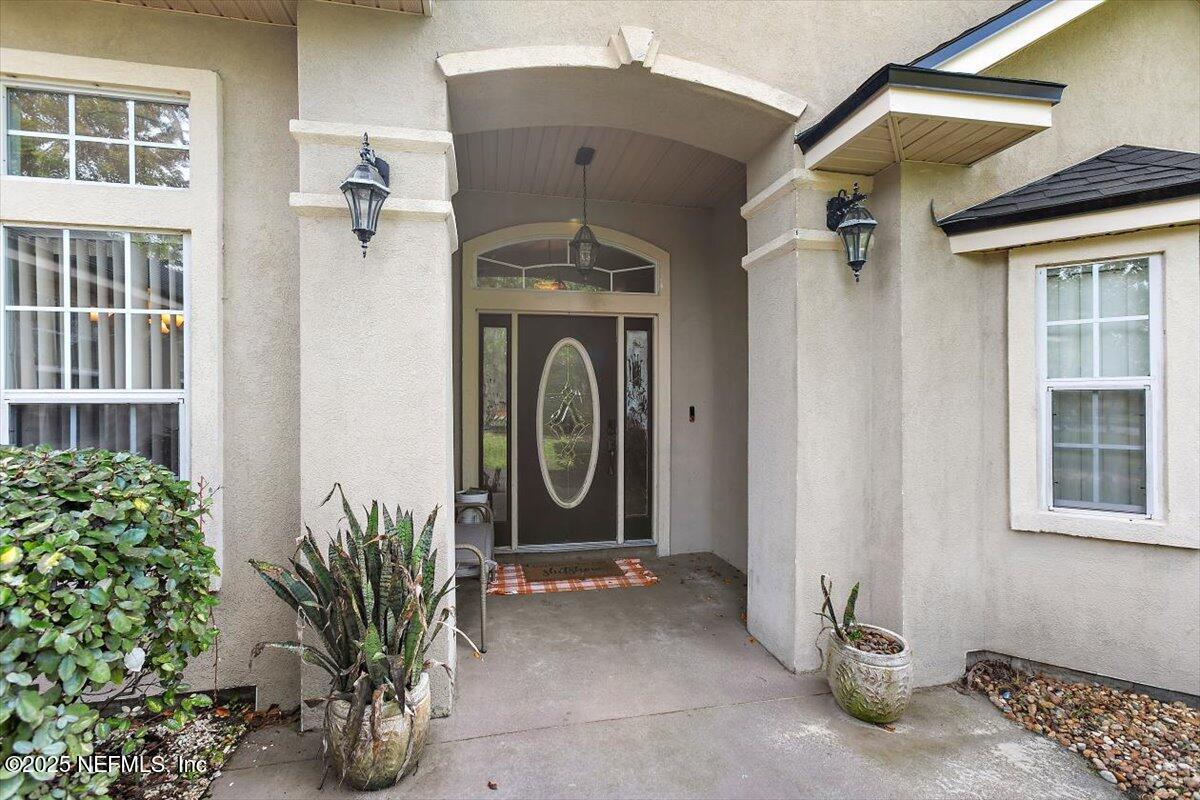 55214 Yellow Jacket Drive Callahan, FL 32011 - Photo 3 of 32 a front view of a house with garden