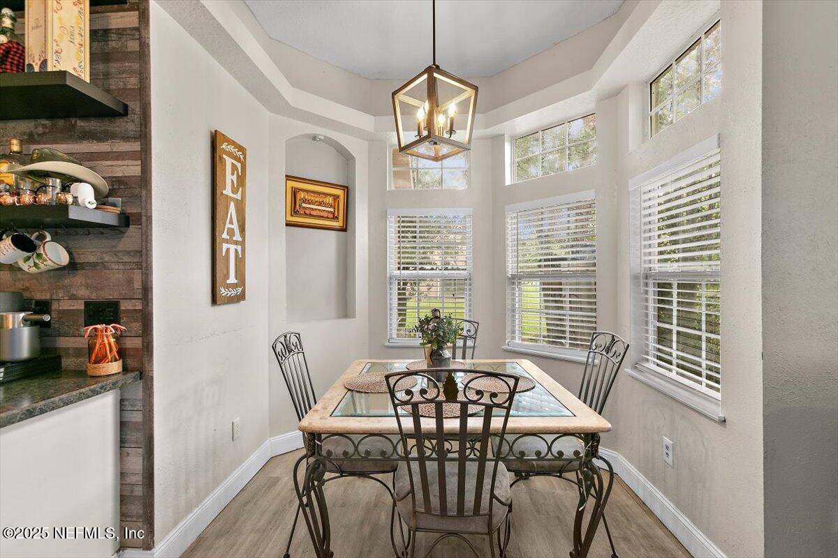 55214 Yellow Jacket Drive Callahan, FL 32011 - Photo 10 of 32 a view of a dining room with furniture window and outside view