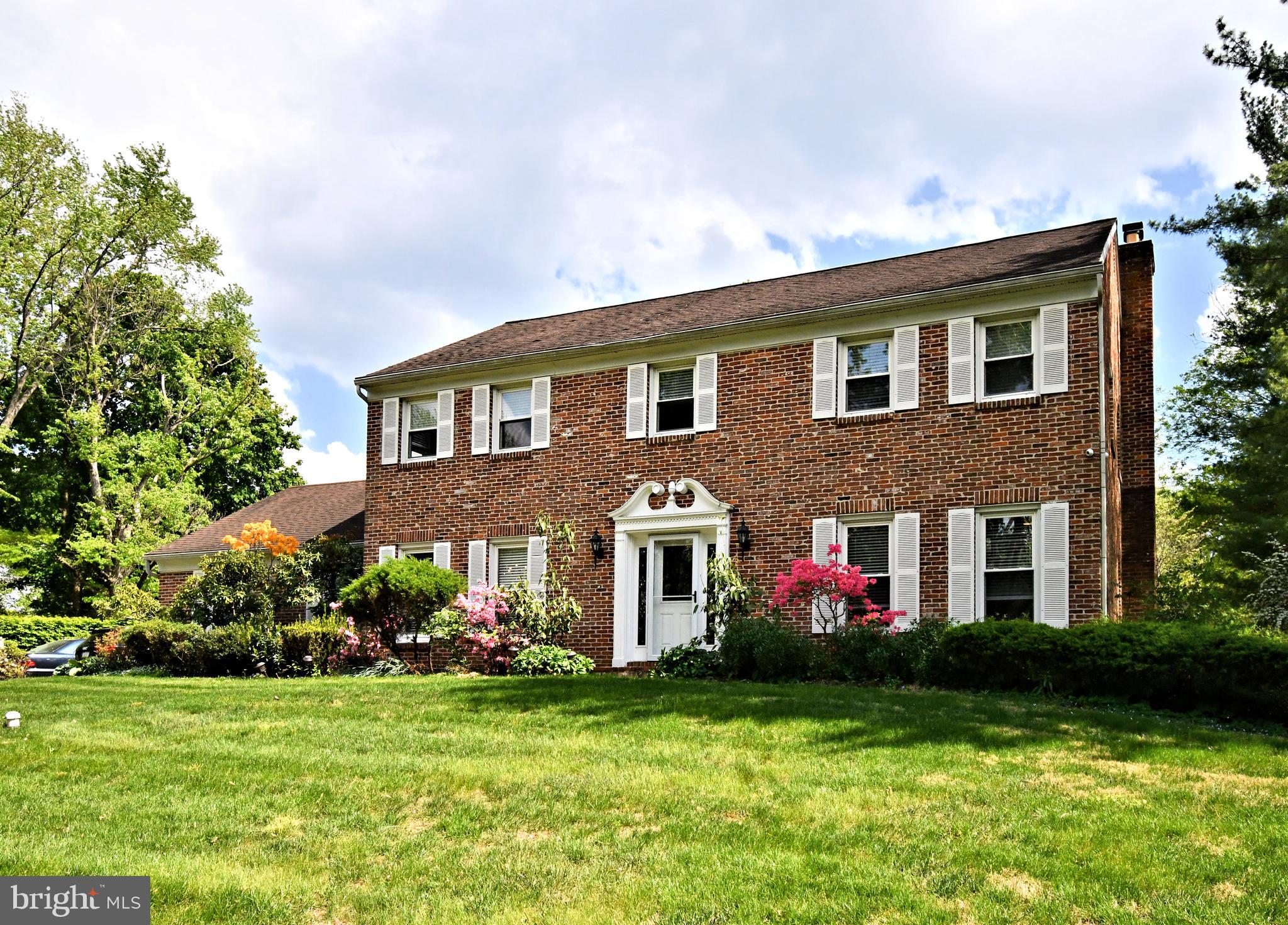 a front view of house and yard with green space