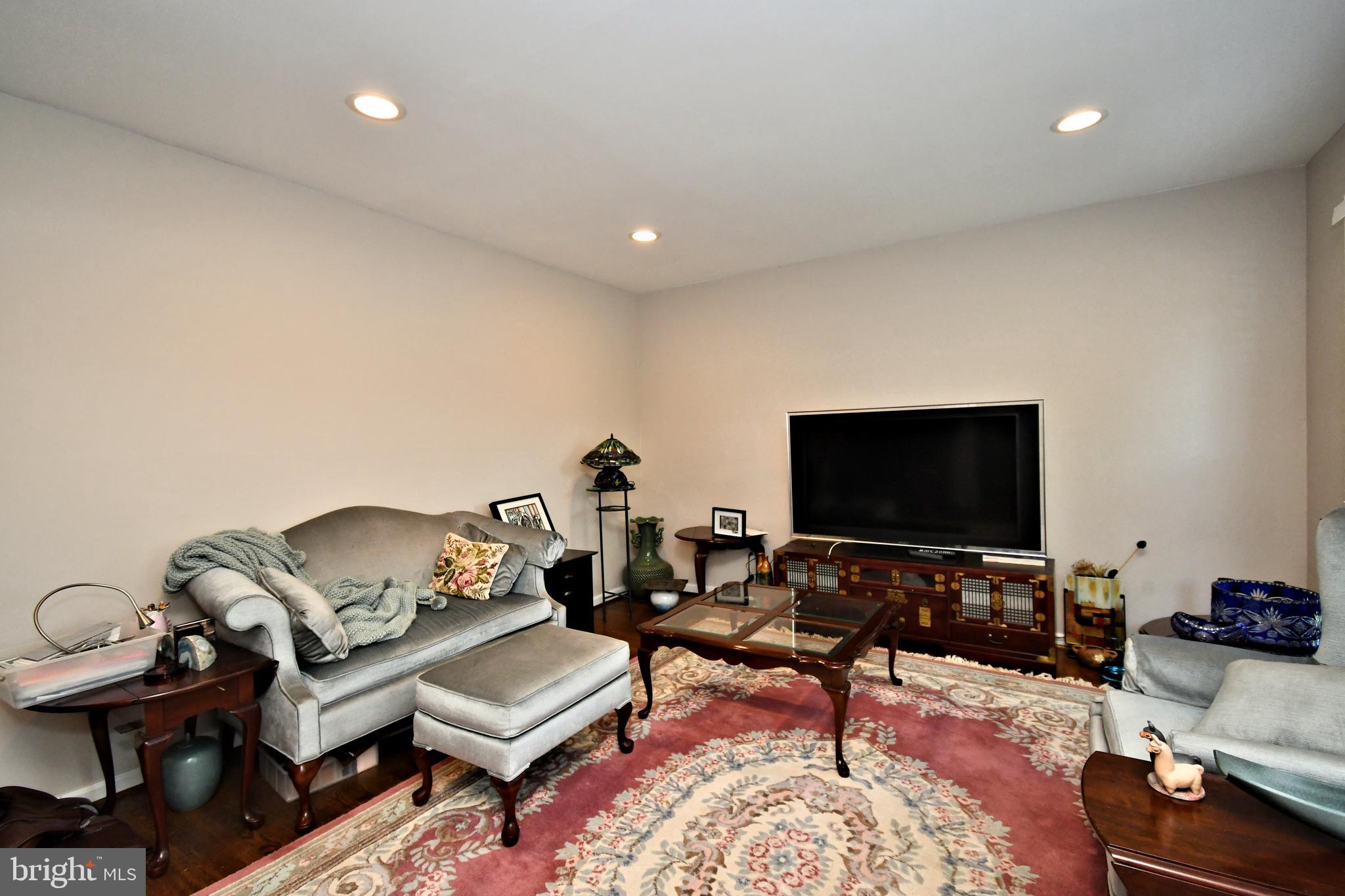 816 Glenn Circle Wayne, PA 19087 - Photo 11 of 63 a living room with furniture and a flat screen tv