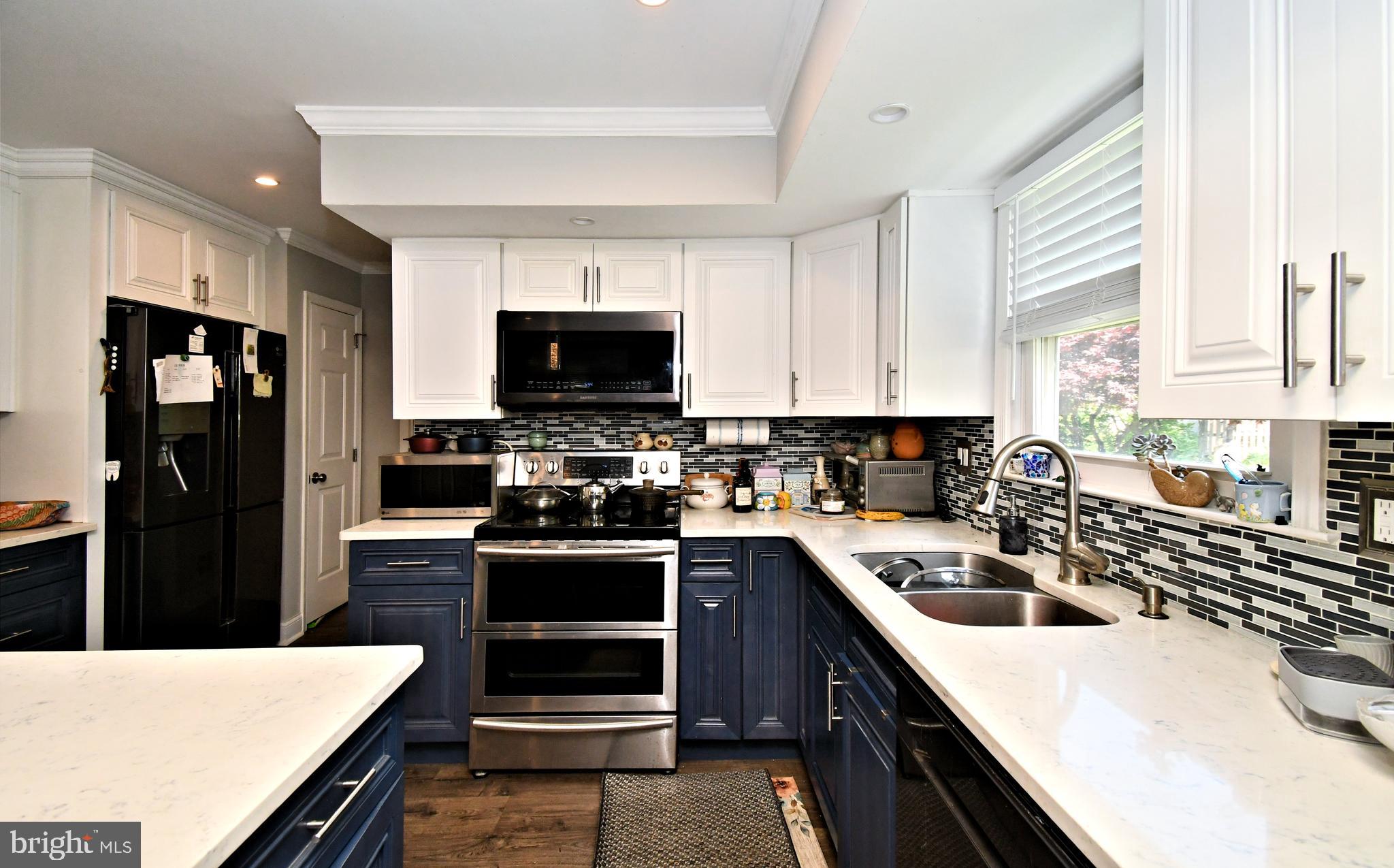 816 Glenn Circle Wayne, PA 19087 - Photo 17 of 63 a kitchen with a sink a stove and refrigerator