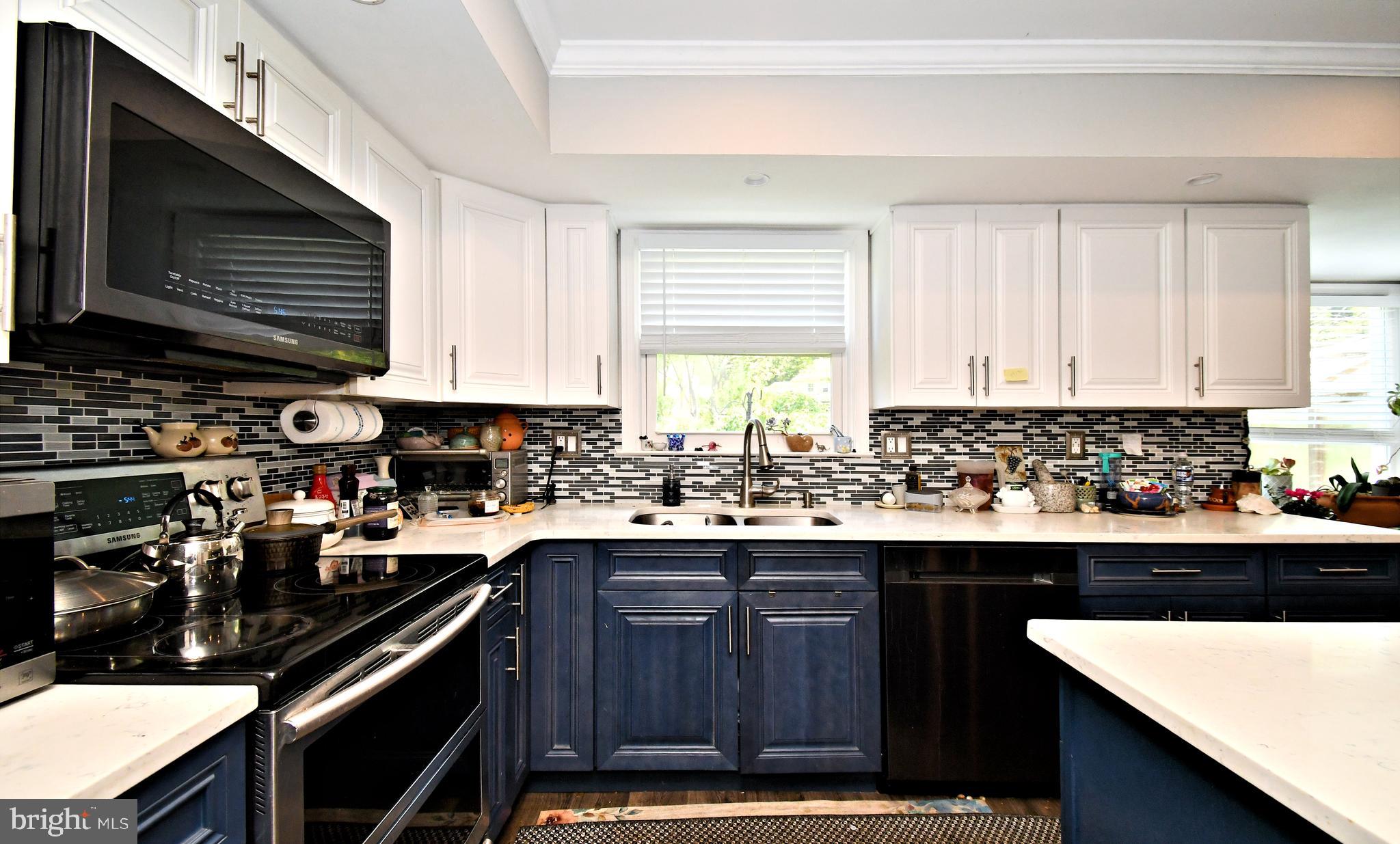 816 Glenn Circle Wayne, PA 19087 - Photo 19 of 63 a kitchen with a sink a stove and cabinets