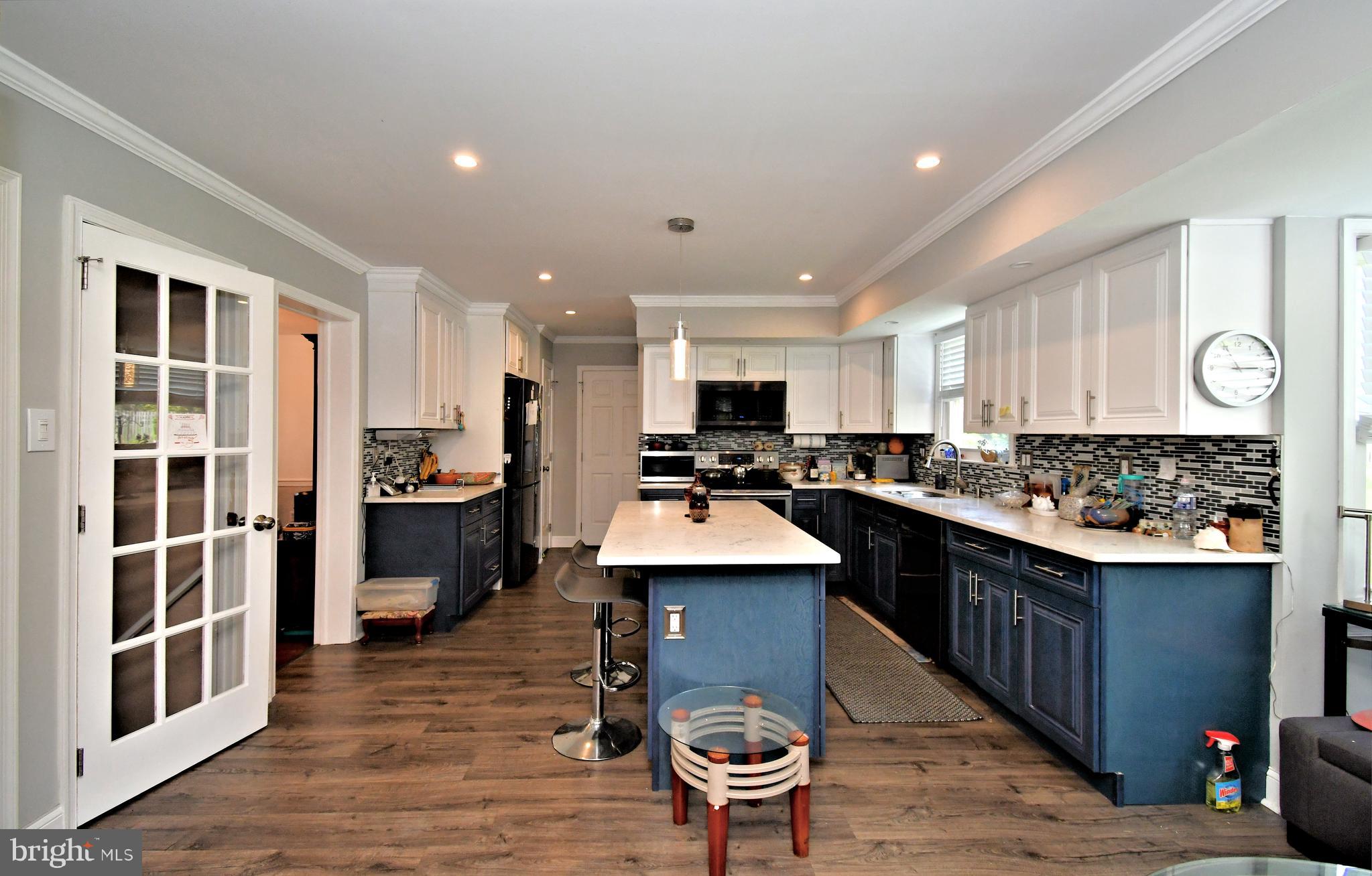 816 Glenn Circle Wayne, PA 19087 - Photo 23 of 63 a kitchen with stainless steel appliances kitchen island granite countertop a sink and cabinets