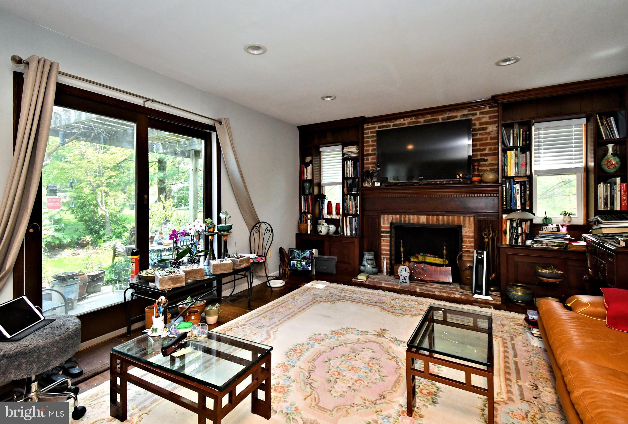 816 Glenn Circle Wayne, PA 19087 - Photo 24 of 63 a living room with furniture a flat screen tv and a fireplace