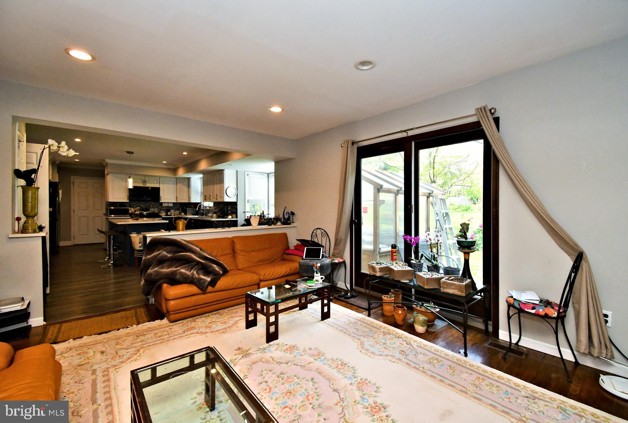 816 Glenn Circle Wayne, PA 19087 - Photo 27 of 63 a living room with furniture a flat screen tv and a large window