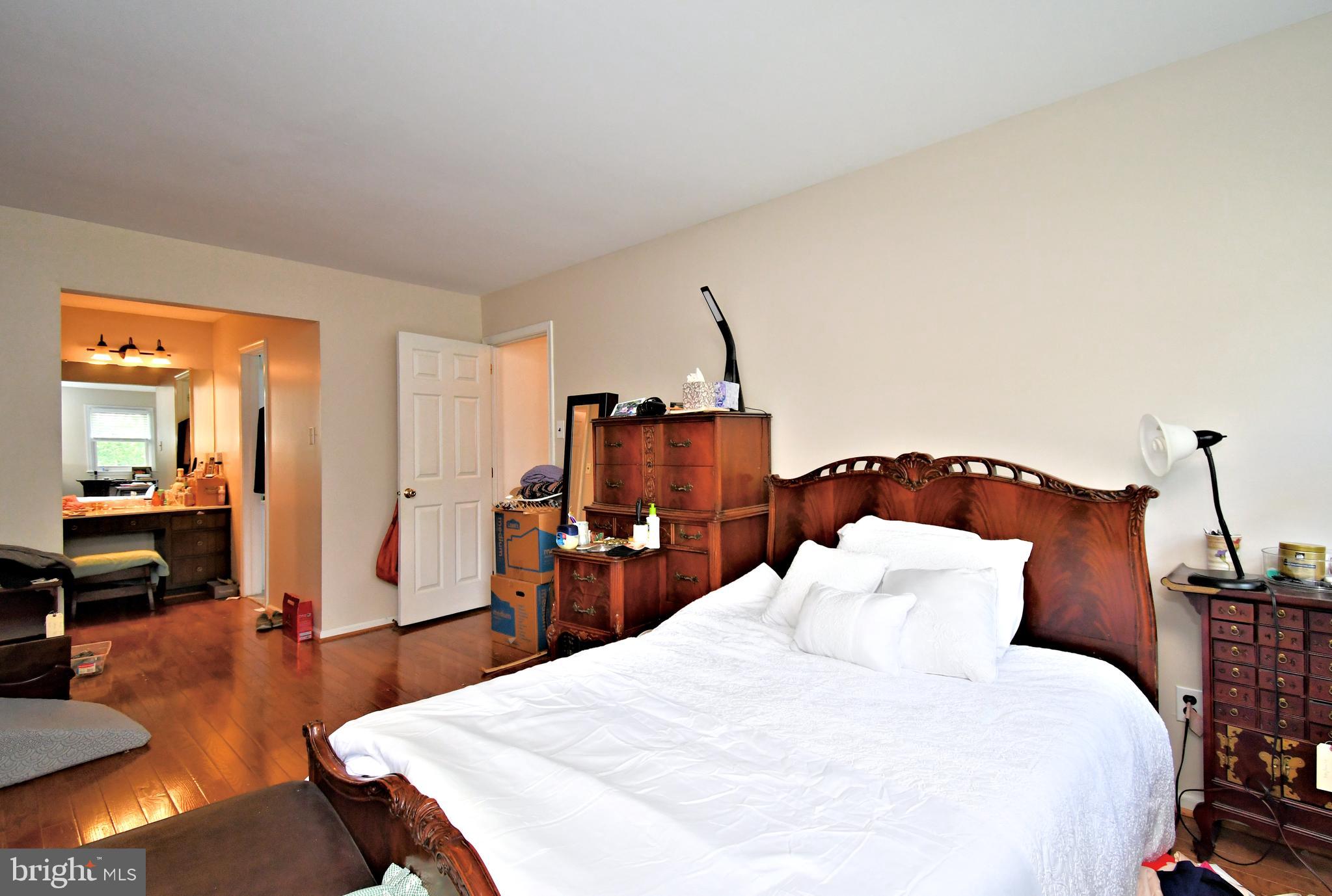 816 Glenn Circle Wayne, PA 19087 - Photo 30 of 63 a bedroom with a bed and wooden floor