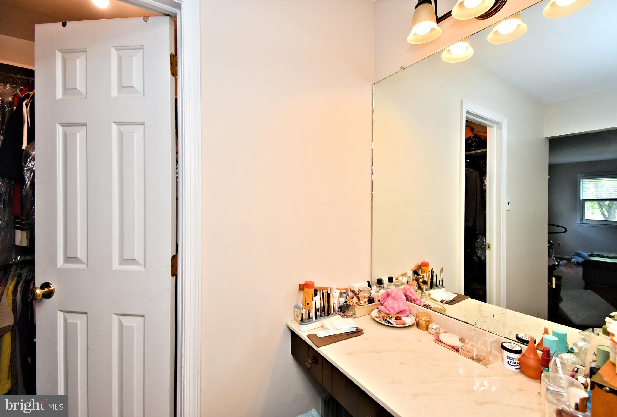 816 Glenn Circle Wayne, PA 19087 - Photo 32 of 63 a bedroom with a bed a dresser and a mirror