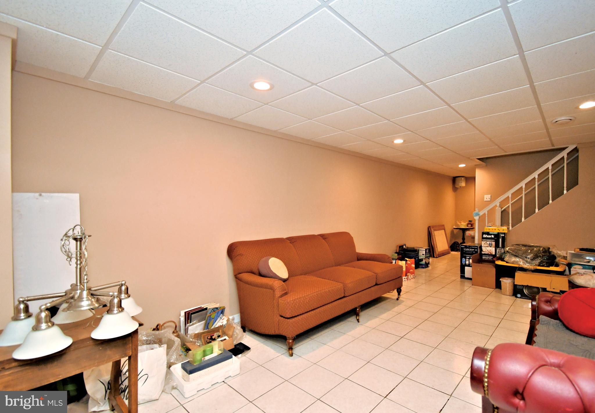 816 Glenn Circle Wayne, PA 19087 - Photo 47 of 63 a living room with furniture and a gym equipment