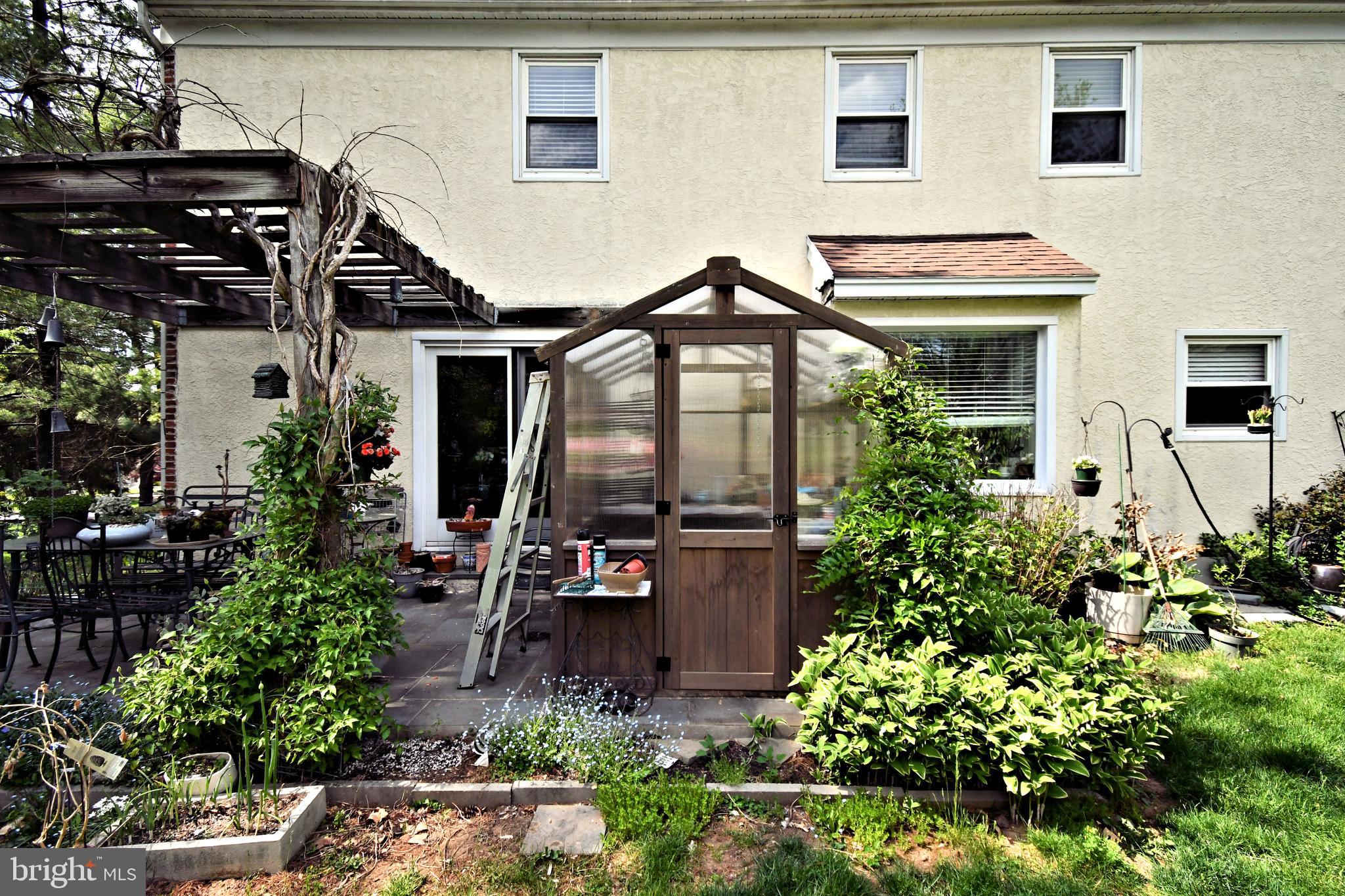 816 Glenn Circle Wayne, PA 19087 - Photo 55 of 63 a front view of house and yard with beautiful flowers