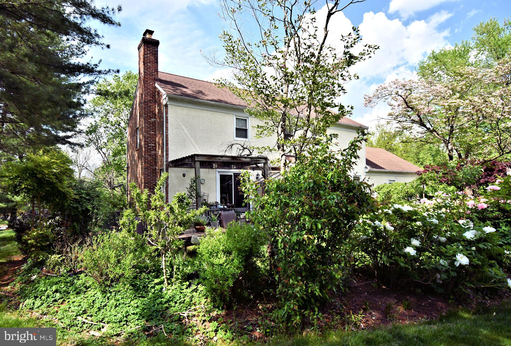 816 Glenn Circle Wayne, PA 19087 - Photo 60 of 63 a front view of a house with a yard and trees
