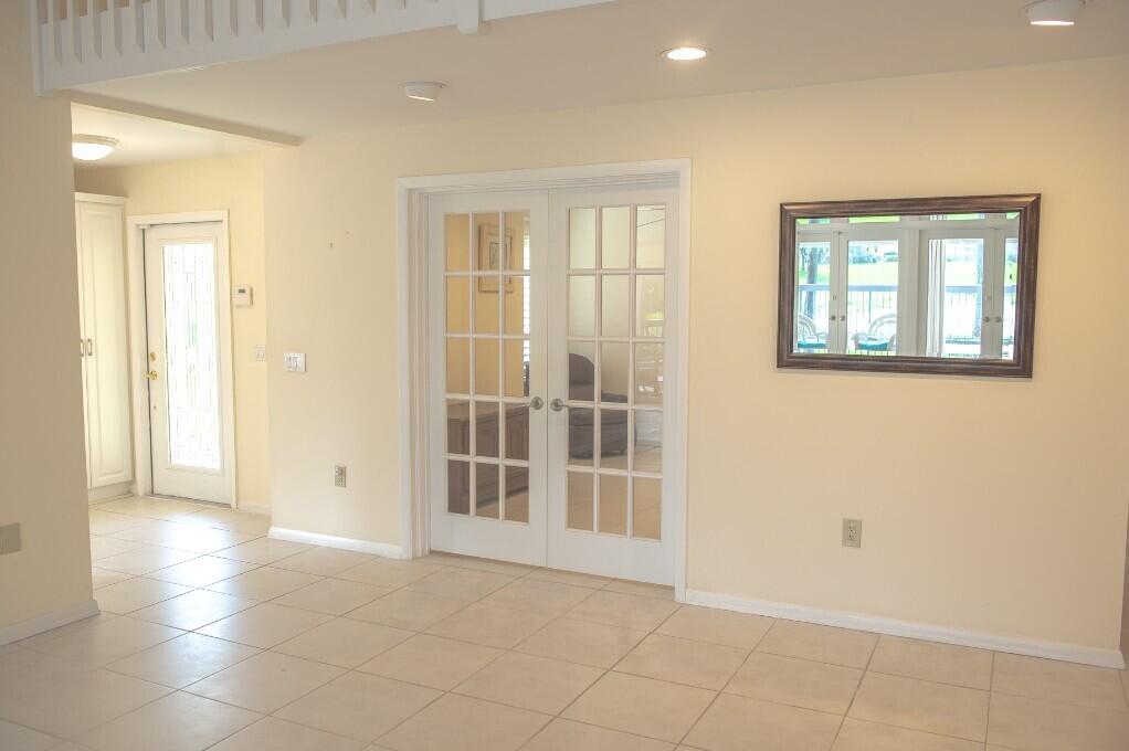 114 Beach Summit Court Jupiter, FL 33477 - Photo 24 of 32 an empty room with windows