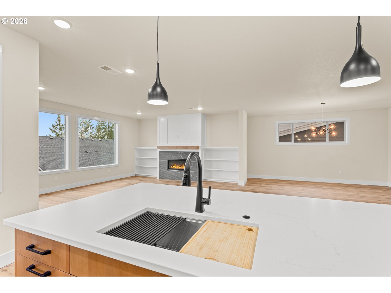 15666 Southwest Everglade Avenue Tigard, OR 97224 - Photo 16 of 45 a picture of a room with wooden floor