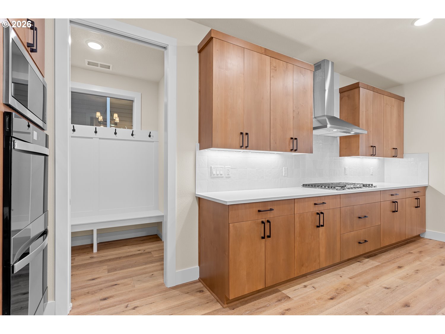 15666 Southwest Everglade Avenue Tigard, OR 97224 - Photo 17 of 45 a view of cabinets with wooden floor and staircase