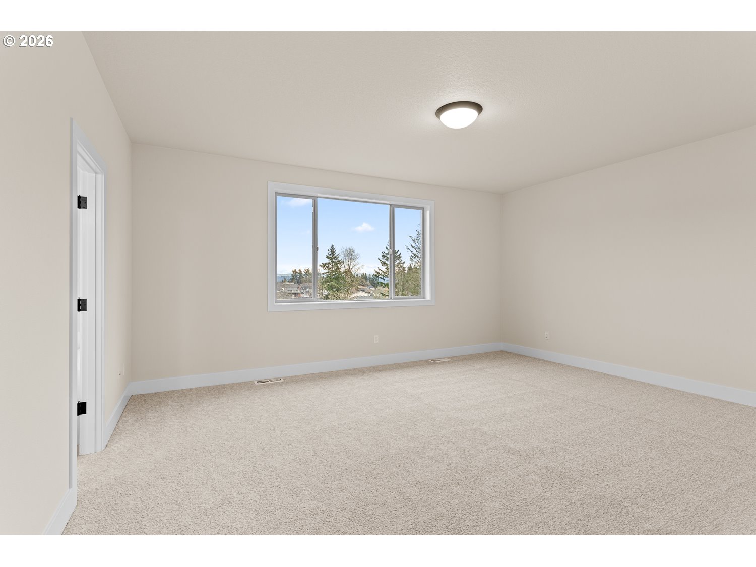 15666 Southwest Everglade Avenue Tigard, OR 97224 - Photo 27 of 45 a view of an empty room with a window