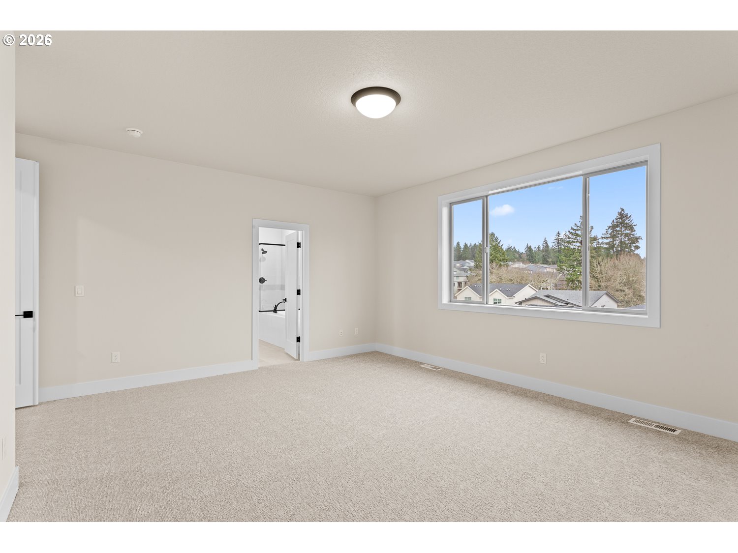 15666 Southwest Everglade Avenue Tigard, OR 97224 - Photo 28 of 45 a view of an empty room with a window