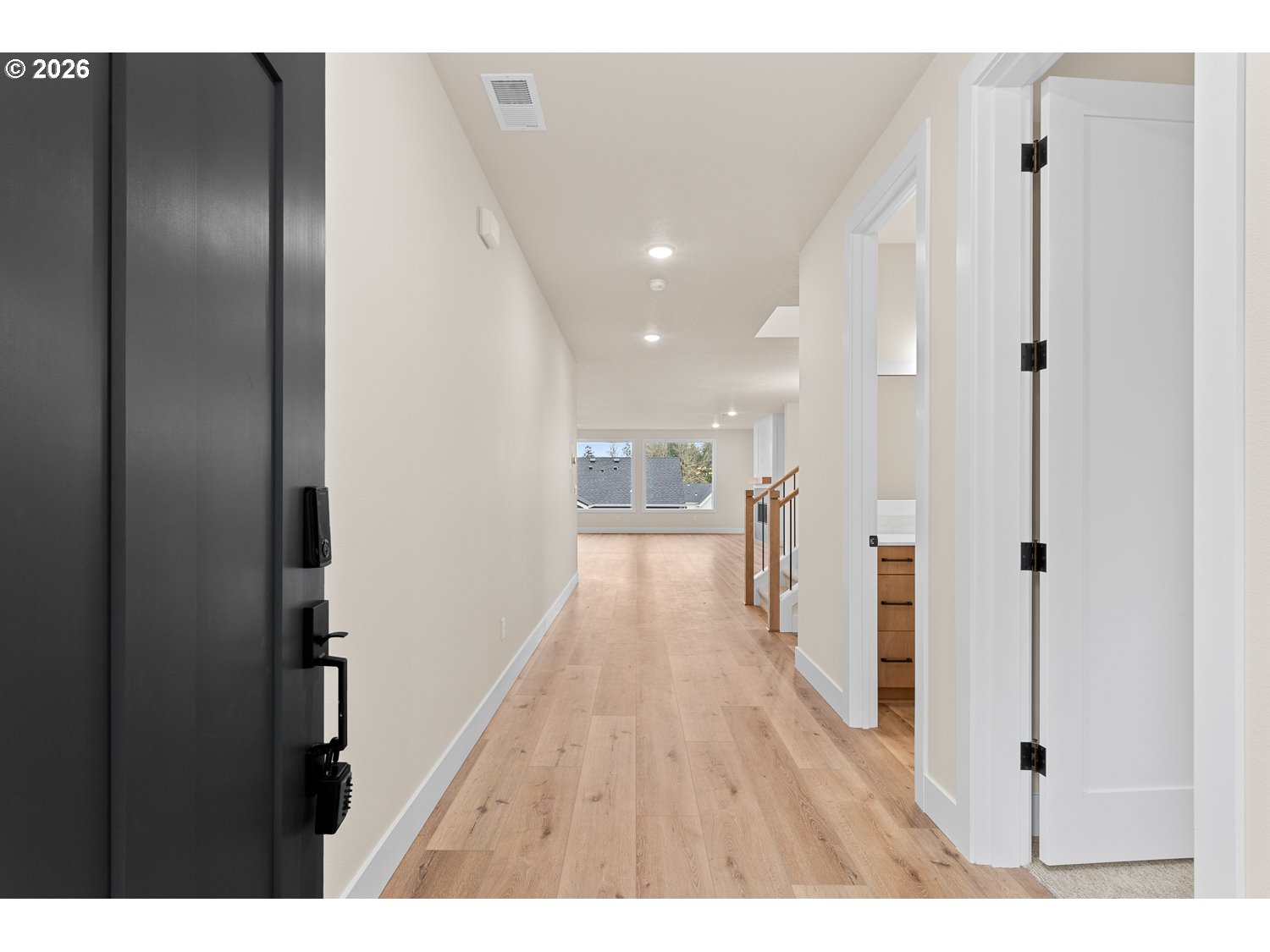 15666 Southwest Everglade Avenue Tigard, OR 97224 - Photo 3 of 45 a view of hallway with wooden floor