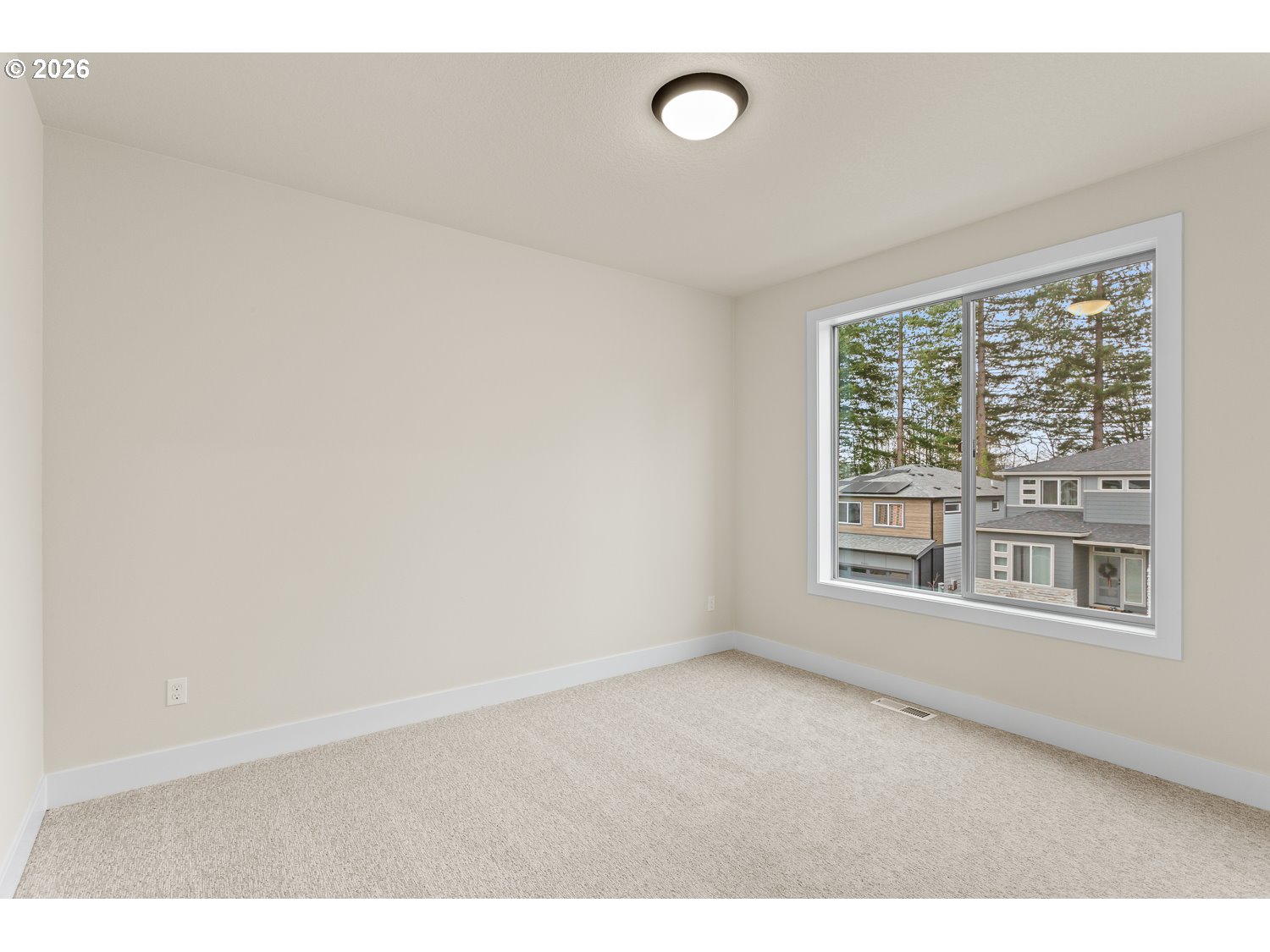 15666 Southwest Everglade Avenue Tigard, OR 97224 - Photo 34 of 45 a view of an empty room with a window