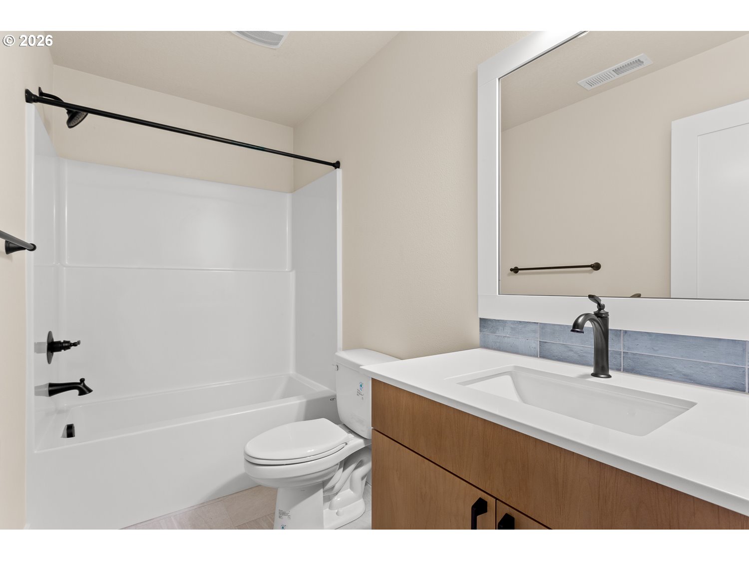 15666 Southwest Everglade Avenue Tigard, OR 97224 - Photo 39 of 45 a bathroom with a sink a toilet and shower