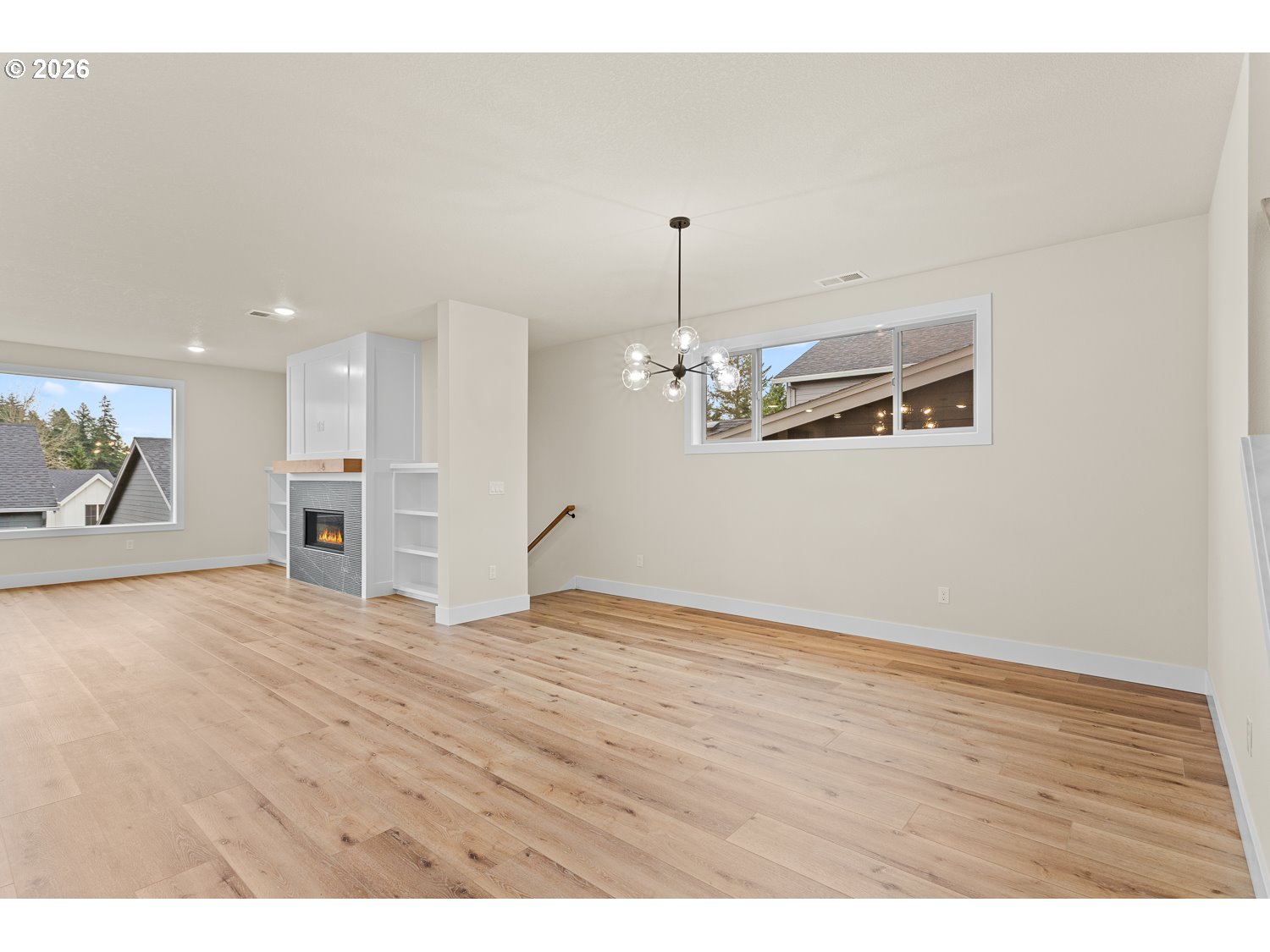 15666 Southwest Everglade Avenue Tigard, OR 97224 - Photo 8 of 45 a view of empty room with wooden floor