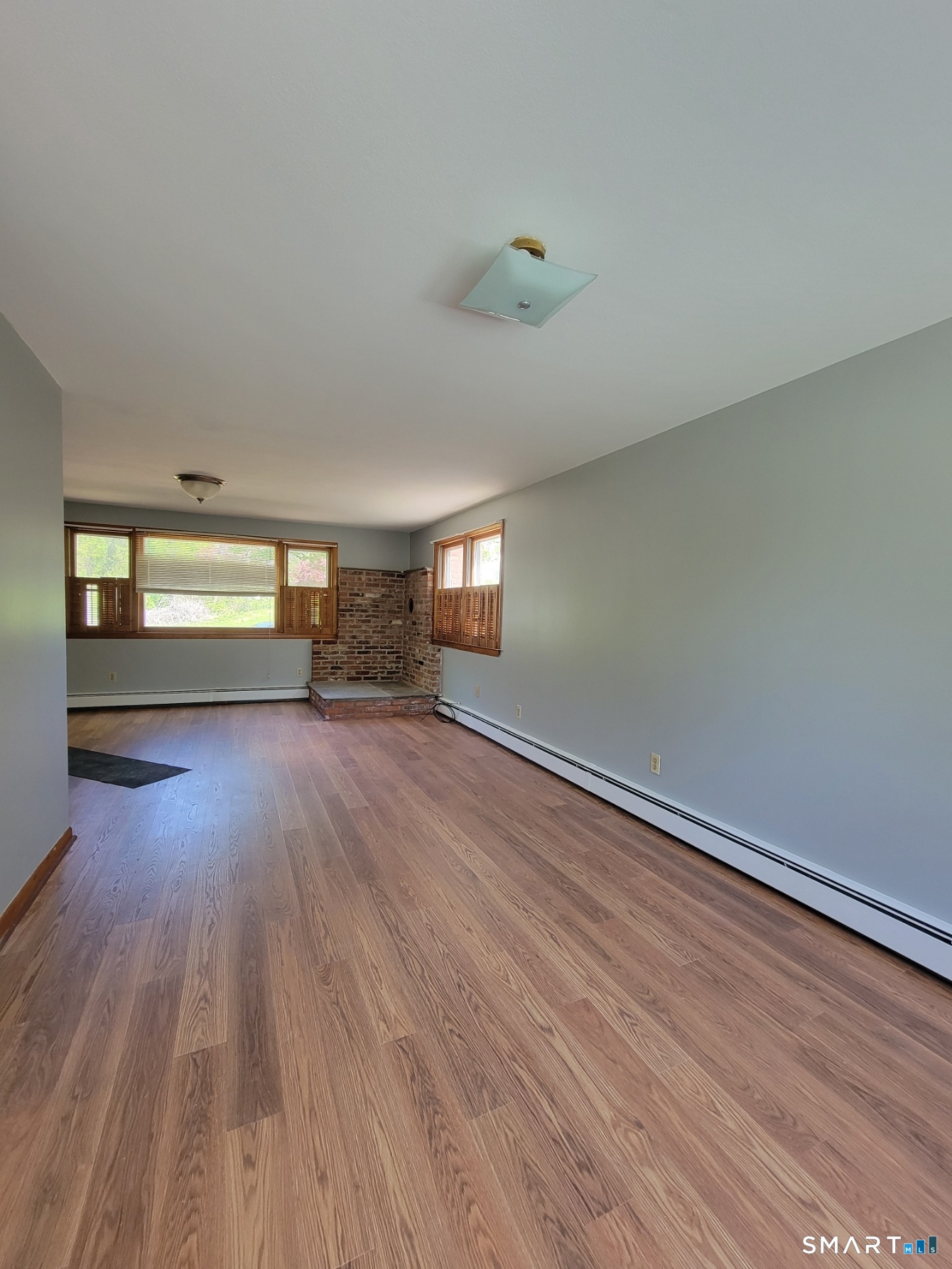 18 Parsonage Road Haddam, CT 06441 - Photo 4 of 10 wooden floor in an empty room with a window