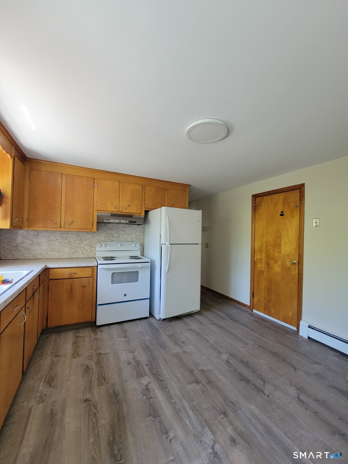 18 Parsonage Road Haddam, CT 06441 - Photo 5 of 10 a view of a kitchen with cabinets and wooden floor