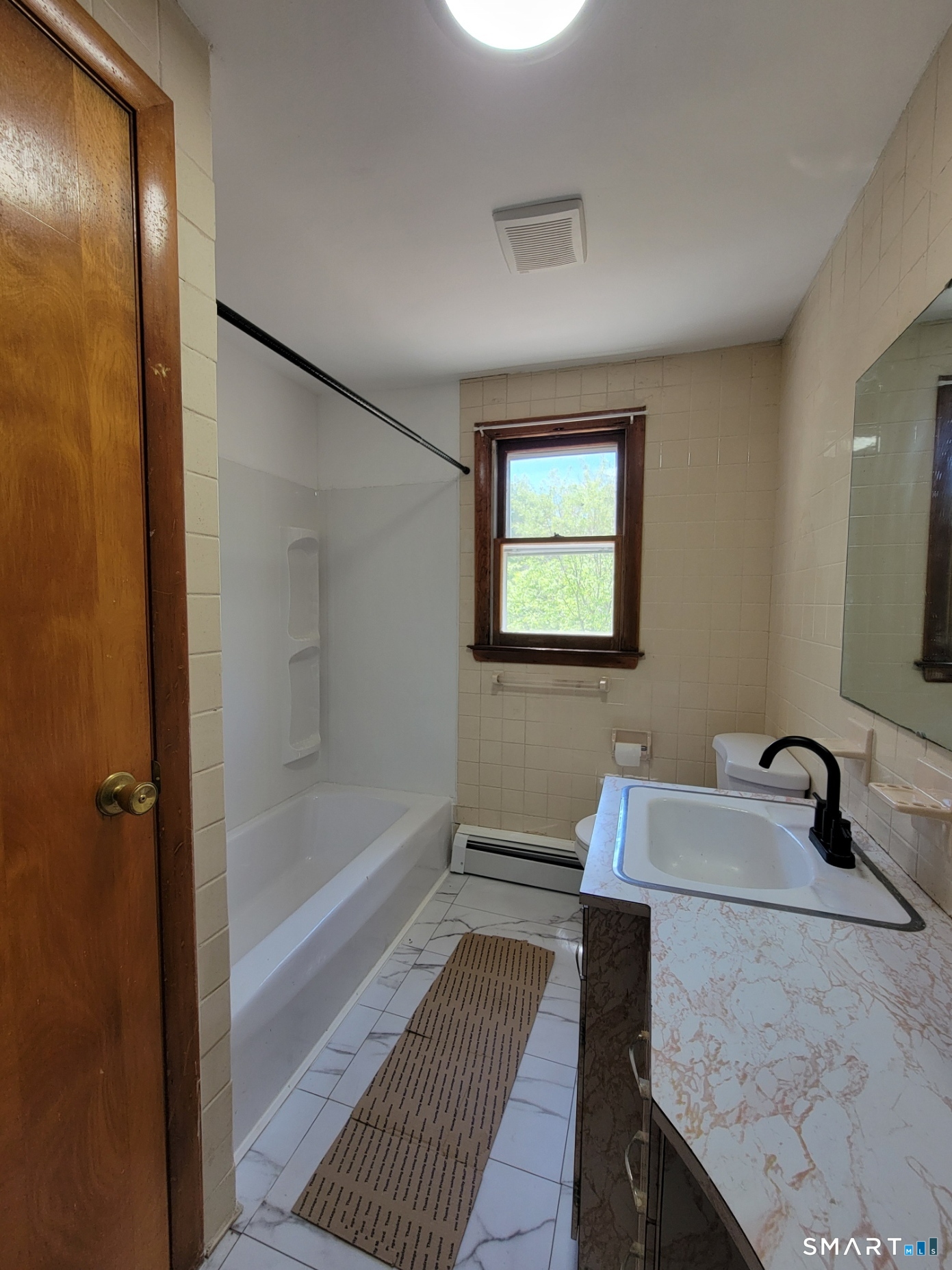 18 Parsonage Road Haddam, CT 06441 - Photo 6 of 10 a bathroom with a sink and a mirror