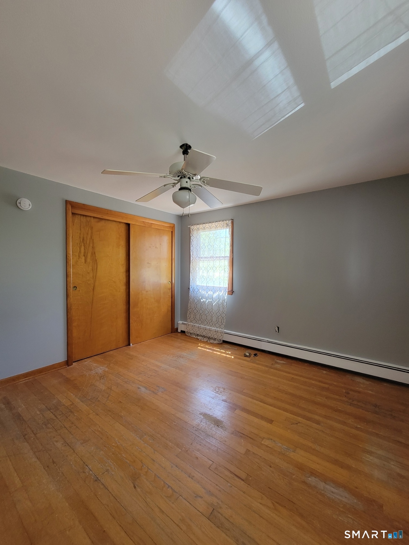 18 Parsonage Road Haddam, CT 06441 - Photo 8 of 10 wooden floor in an empty room with a window