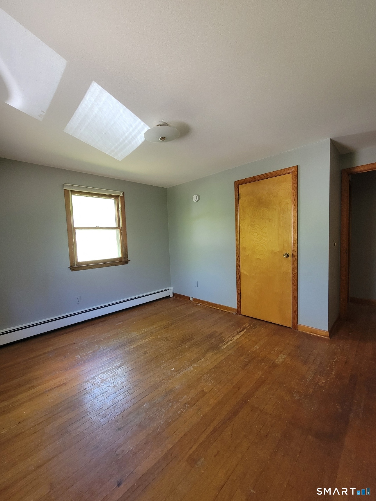 18 Parsonage Road Haddam, CT 06441 - Photo 10 of 10 an empty room with wooden floor and windows