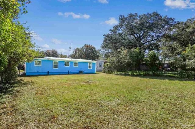 a view of a pool with a yard