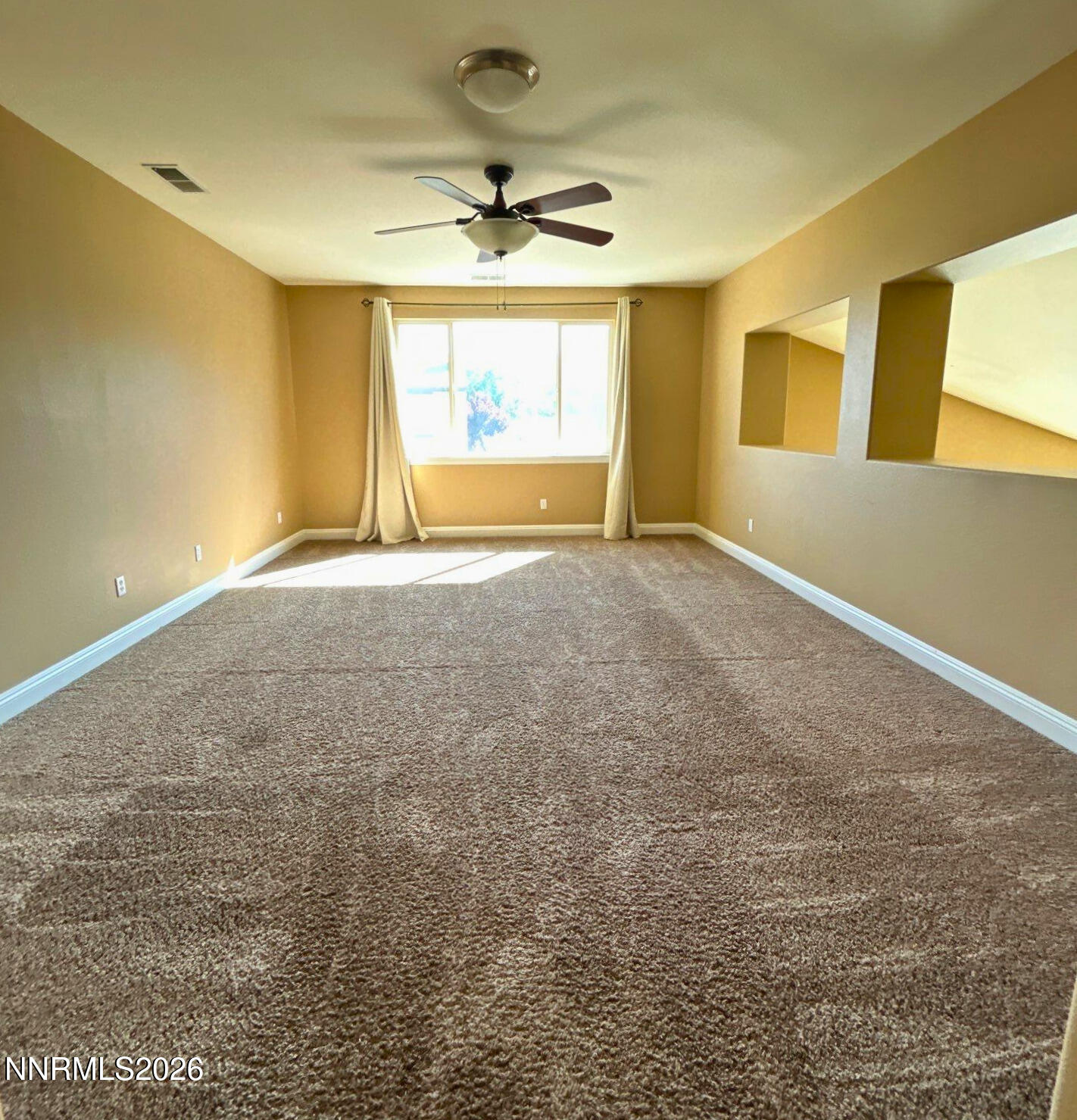 635 Ubaldo Court Reno, NV 89521 - Photo 11 of 22 a view of an empty room with a window