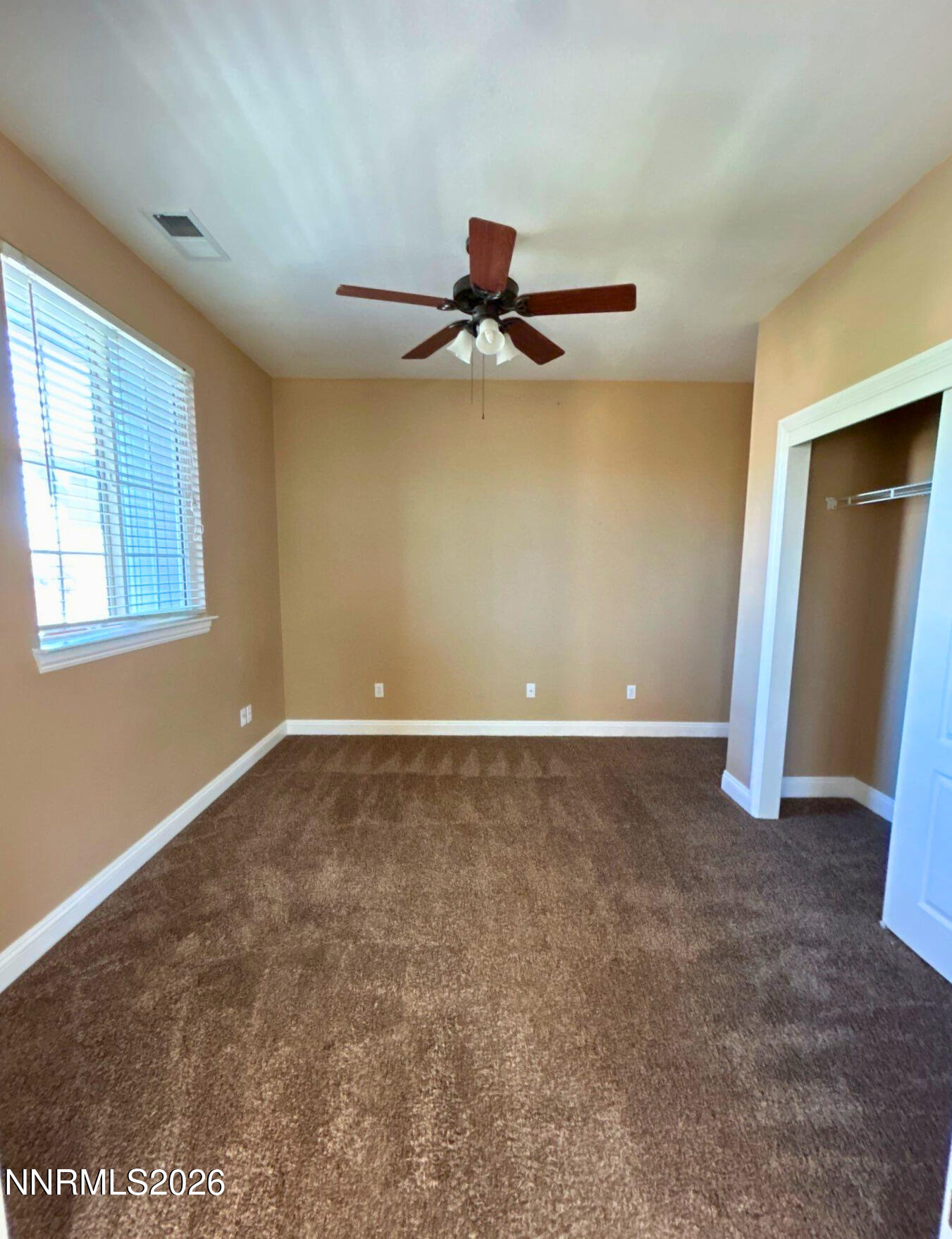 635 Ubaldo Court Reno, NV 89521 - Photo 15 of 22 wooden floor in an empty room with a window