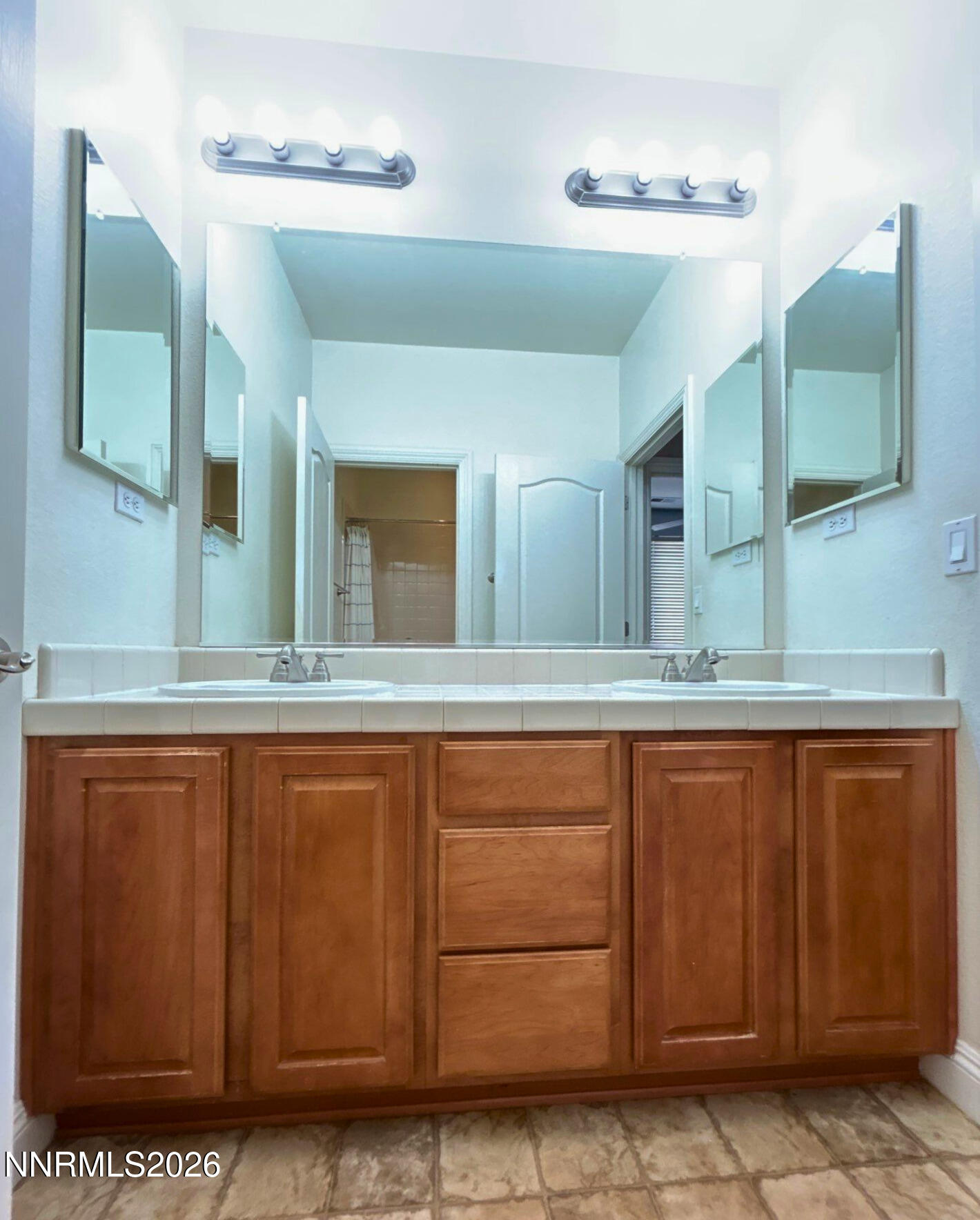 635 Ubaldo Court Reno, NV 89521 - Photo 19 of 22 a bathroom with a sink and mirror