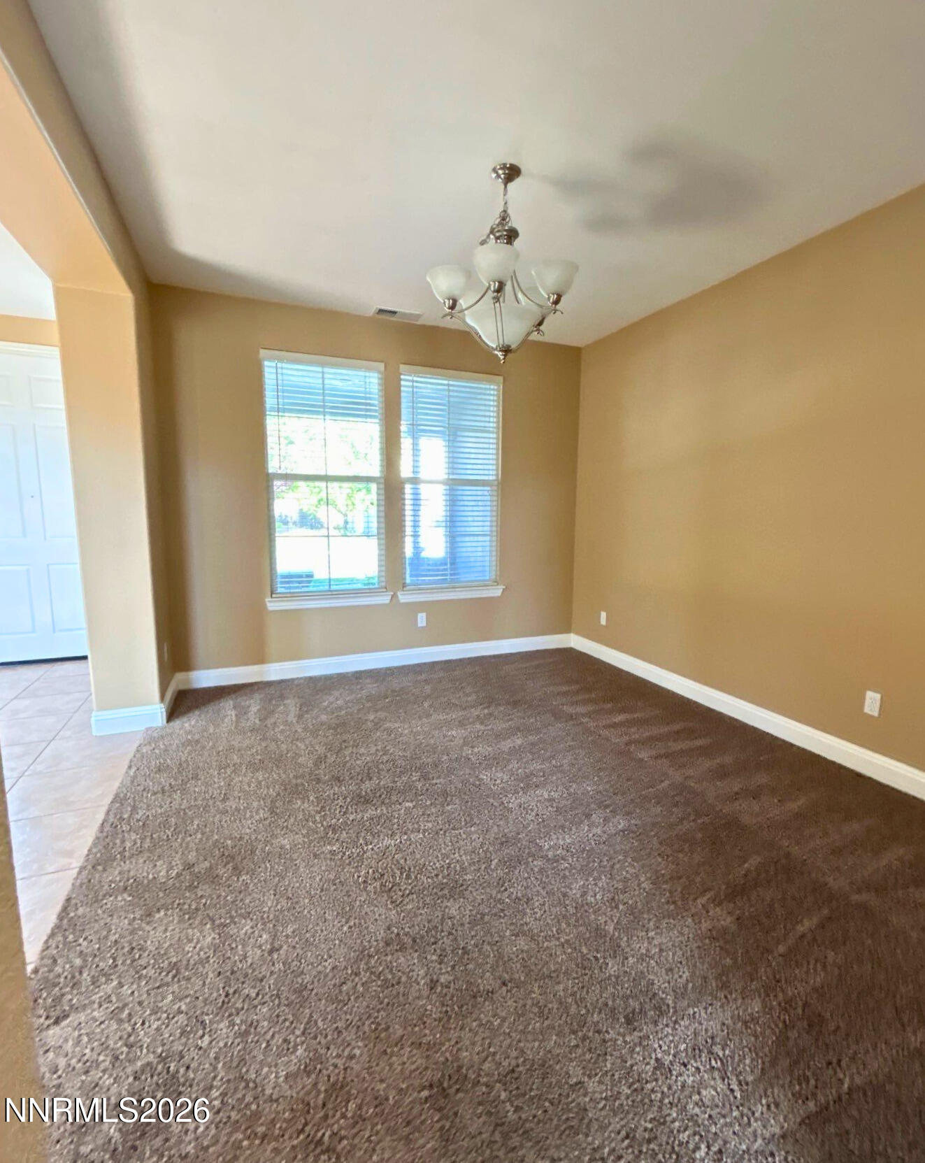 635 Ubaldo Court Reno, NV 89521 - Photo 4 of 22 wooden floor in an empty room with a window