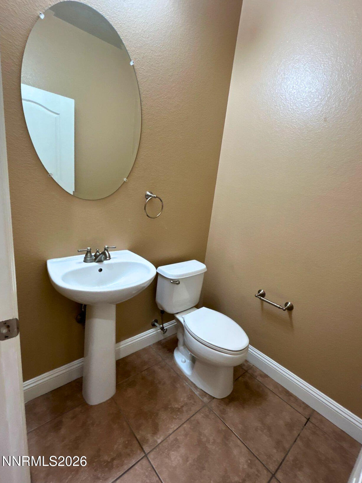 635 Ubaldo Court Reno, NV 89521 - Photo 10 of 22 a bathroom with a sink and a mirror