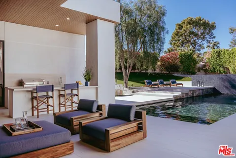a view of a patio with couches and chairs