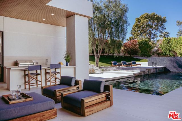 a view of a patio with couches and chairs