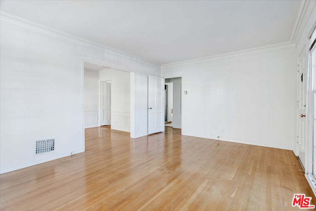 142 North Hamilton Drive, Unit A Beverly Hills, CA 90211 - Photo 2 of 8 a view of an empty room and wooden floor