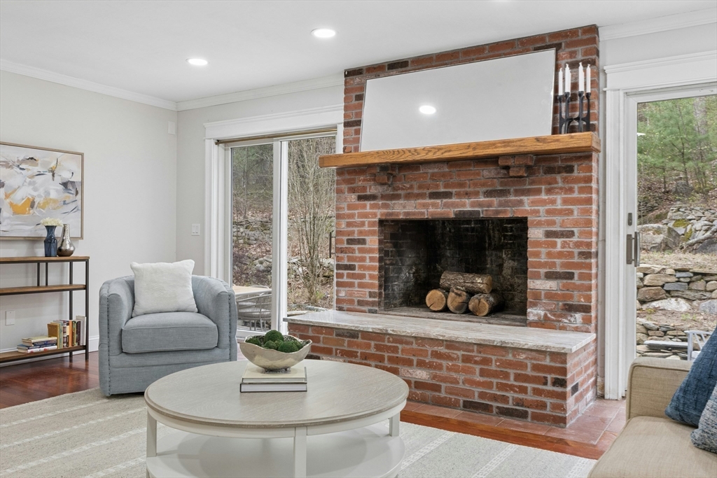 184 Old Bolton Road Stow, MA 01775 - Photo 15 of 39 a living room with furniture and a fireplace