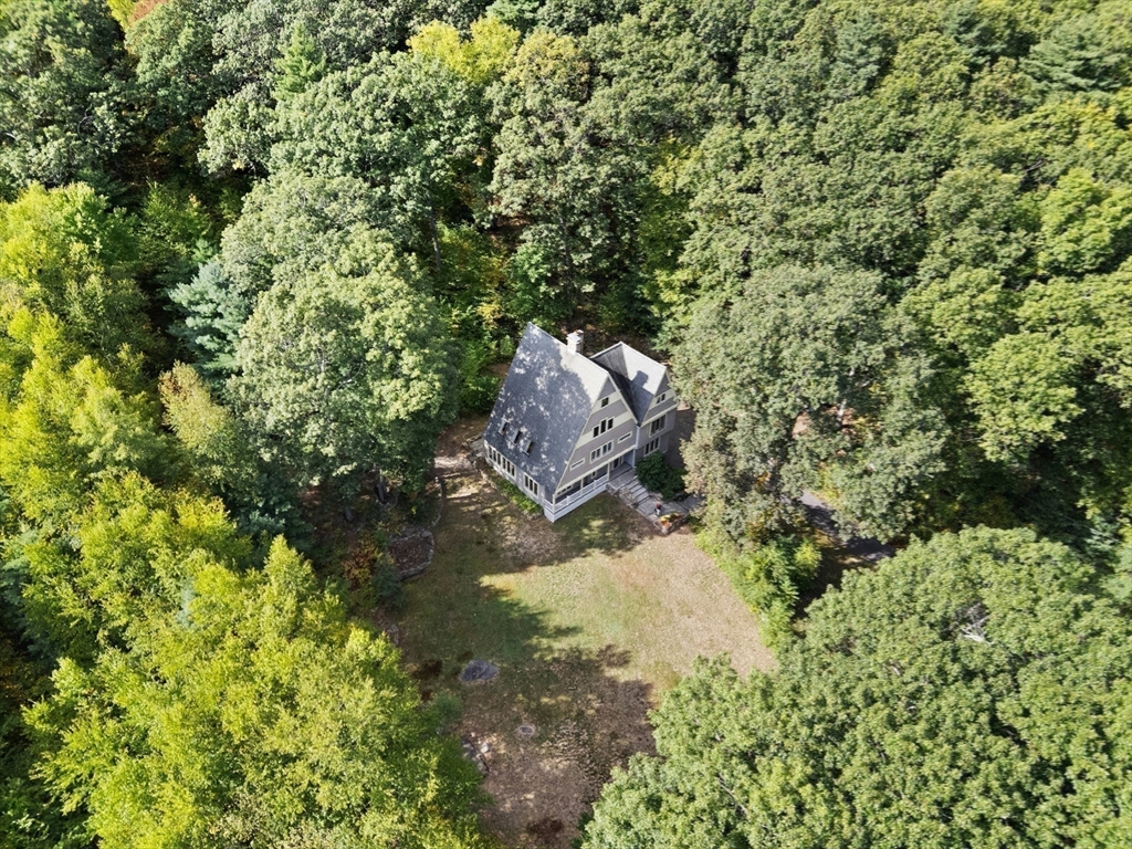 184 Old Bolton Road Stow, MA 01775 - Photo 36 of 39 a backyard of a house with a yard and outdoor seating