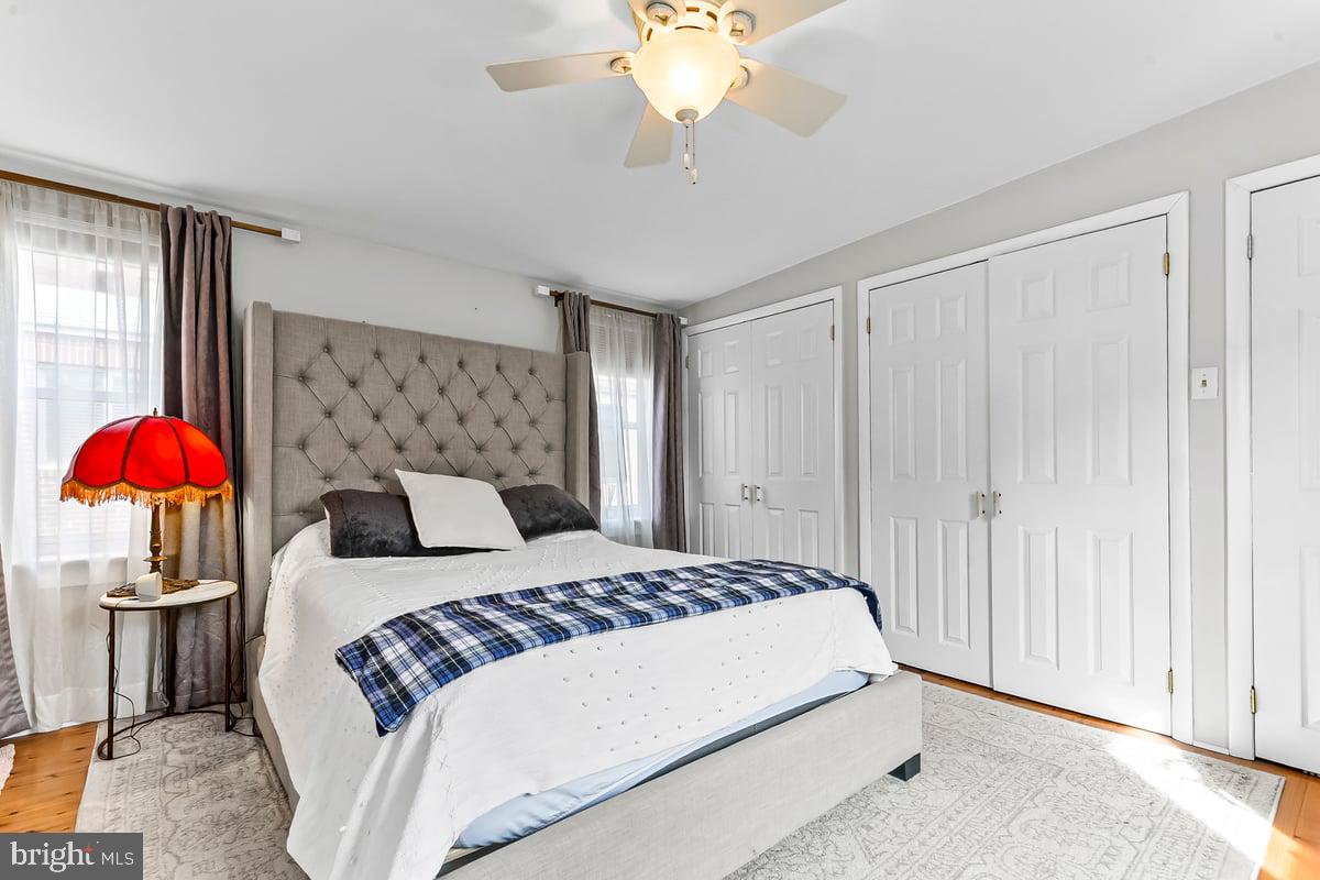 1718 Rodman Street Philadelphia, PA 19146 - Photo 17 of 29 a bedroom with a bed and a chandelier