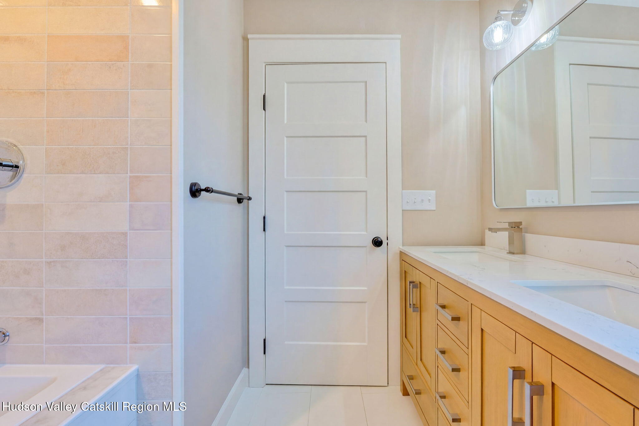 11 Mueller Road Saugerties, NY 12453 - Photo 23 of 36 a bathroom with a granite countertop sink a mirror and a bathtub