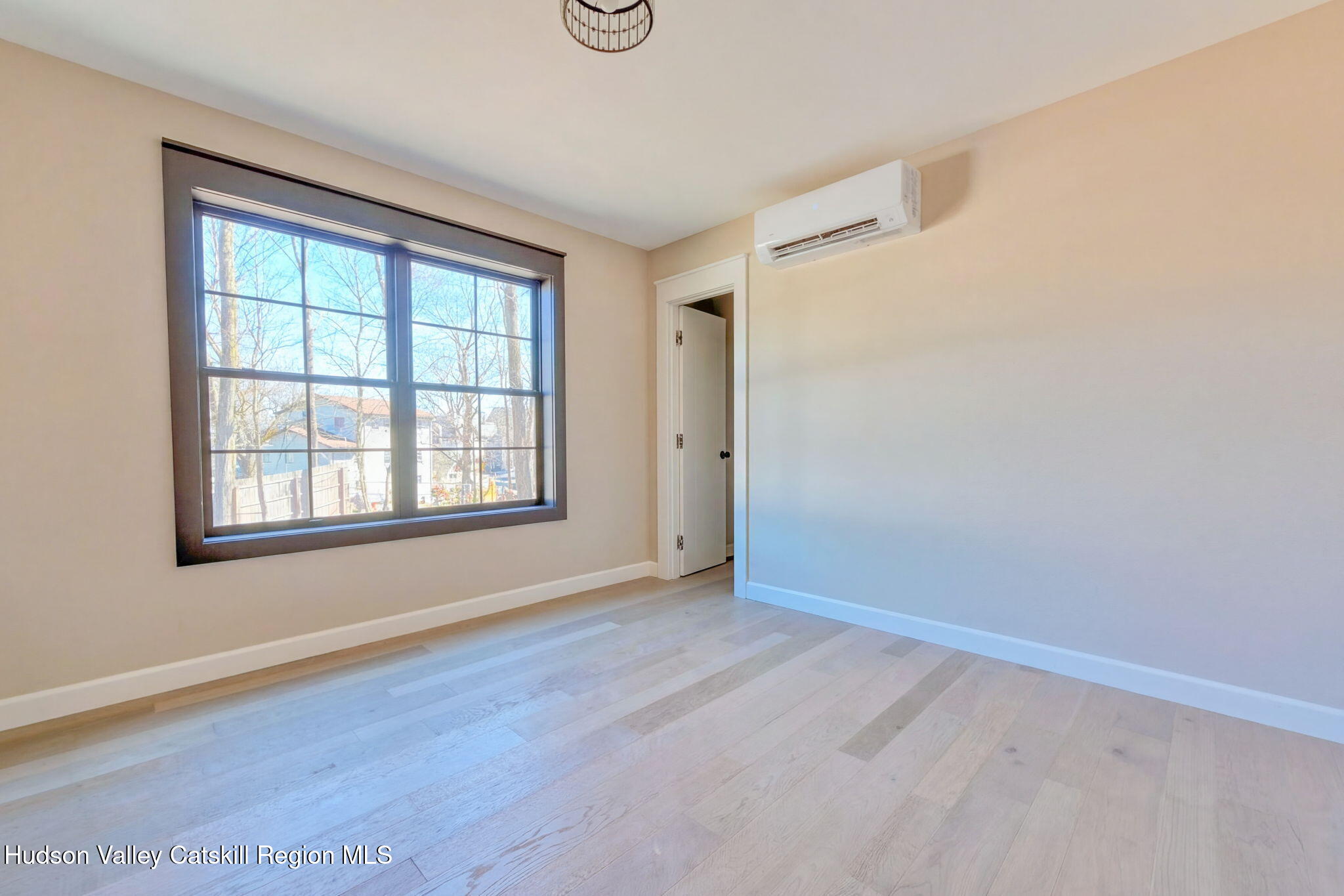 11 Mueller Road Saugerties, NY 12453 - Photo 24 of 36 an empty room with wooden floor and windows