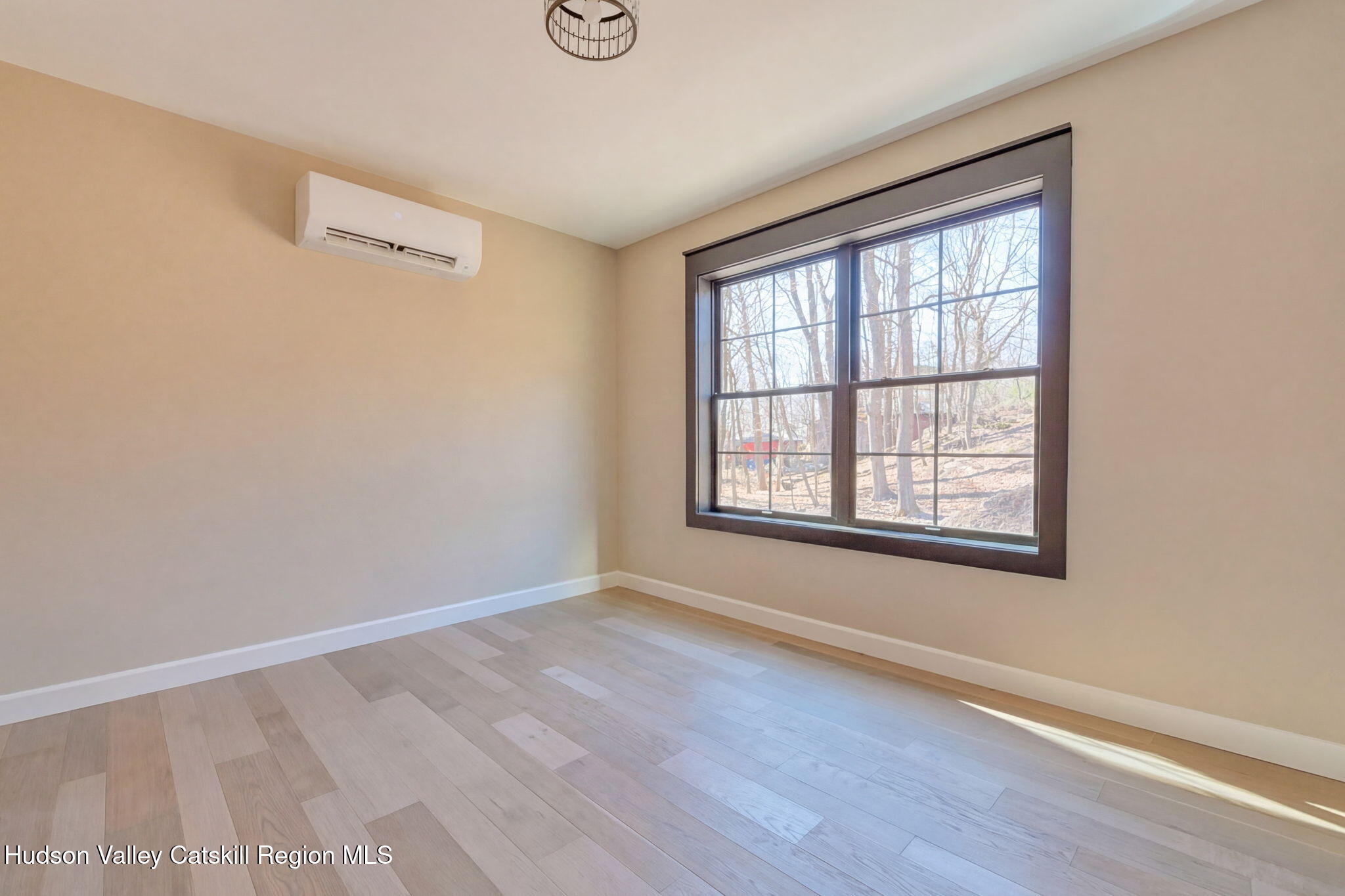 11 Mueller Road Saugerties, NY 12453 - Photo 25 of 36 an empty room with wooden floor and windows