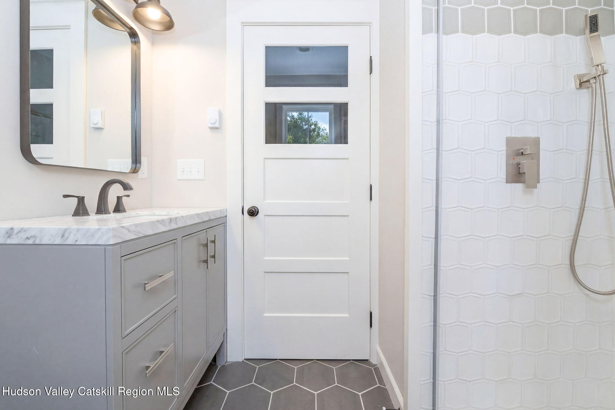 11 Mueller Road Saugerties, NY 12453 - Photo 26 of 36 a bathroom with a double vanity sink a mirror and a shower