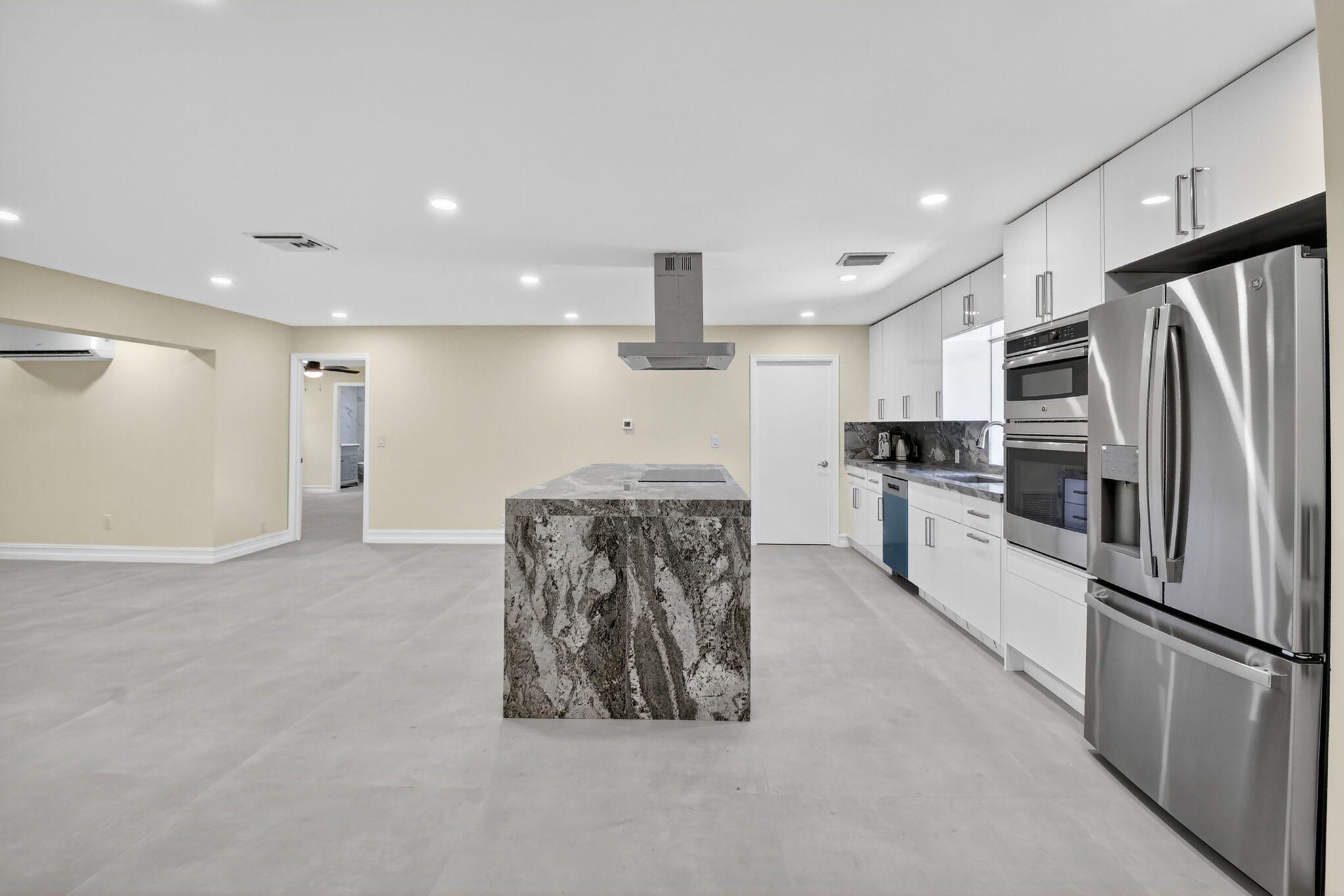 6251 Hitchin Post Way Delray Beach, FL 33484 - Photo 14 of 67 a kitchen with stainless steel appliances granite countertop a refrigerator a stove and a sink