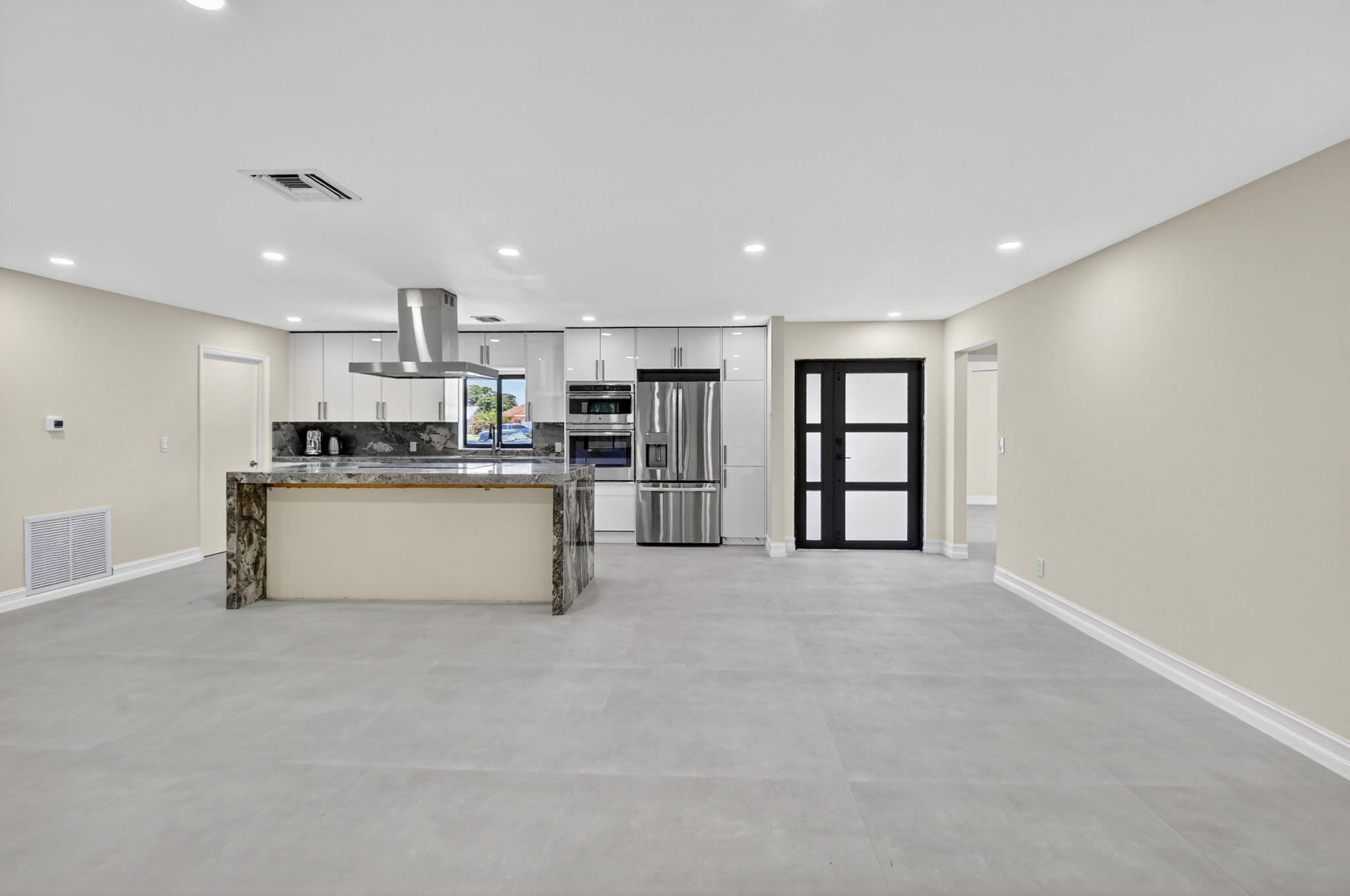 6251 Hitchin Post Way Delray Beach, FL 33484 - Photo 16 of 67 a kitchen with stainless steel appliances a refrigerator sink and cabinets