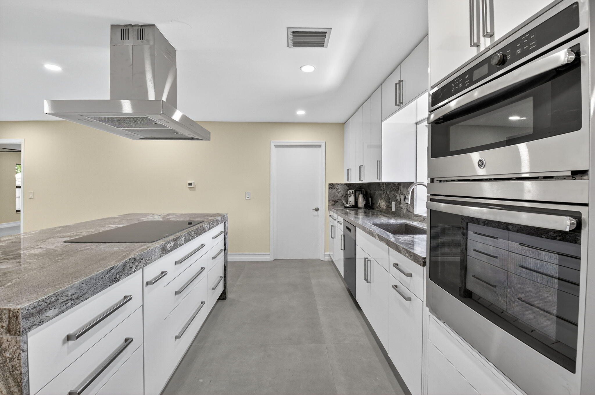 6251 Hitchin Post Way Delray Beach, FL 33484 - Photo 19 of 67 a kitchen with granite countertop a stove and a sink