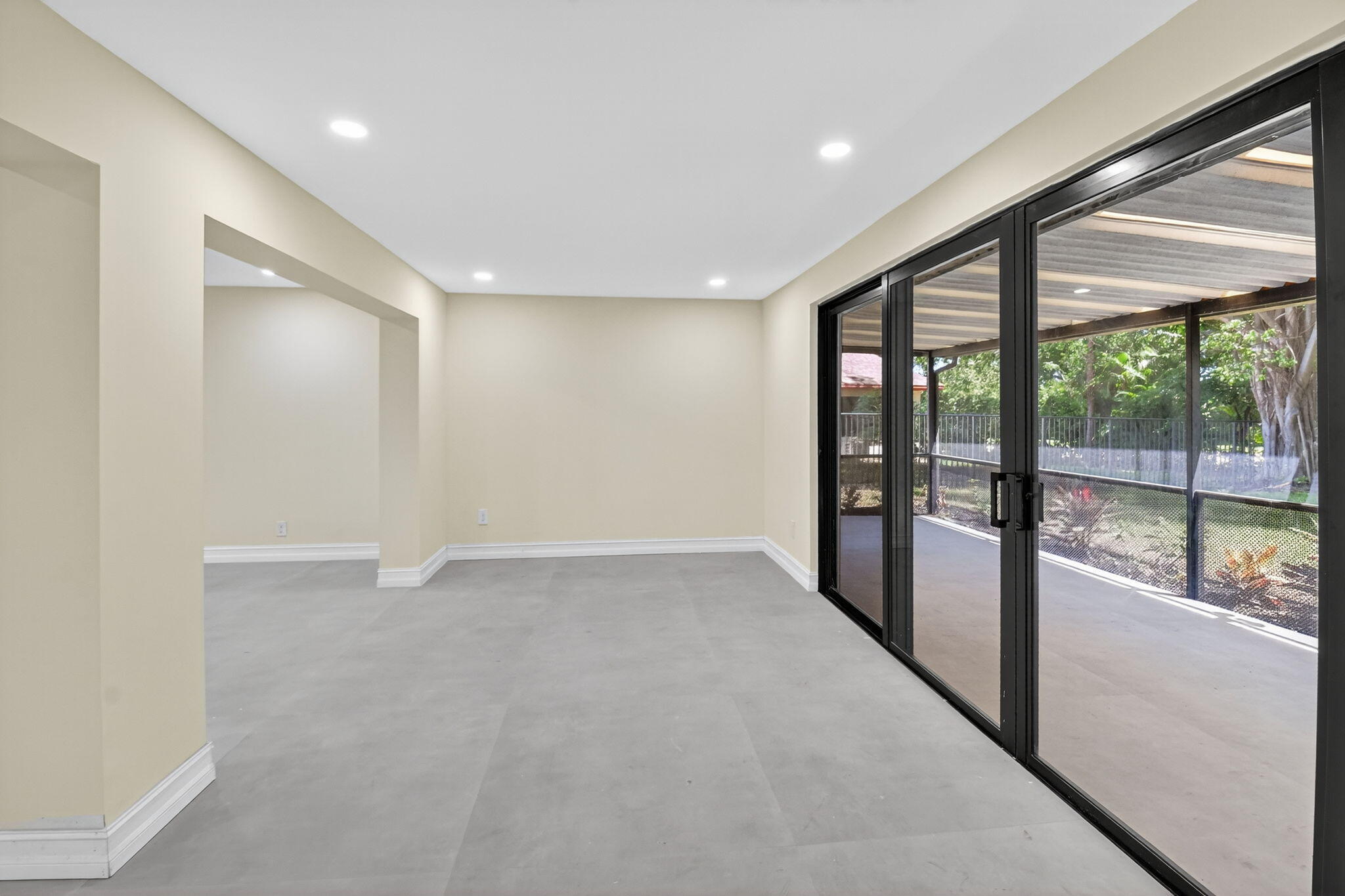 6251 Hitchin Post Way Delray Beach, FL 33484 - Photo 23 of 67 a view of an empty room with large windows